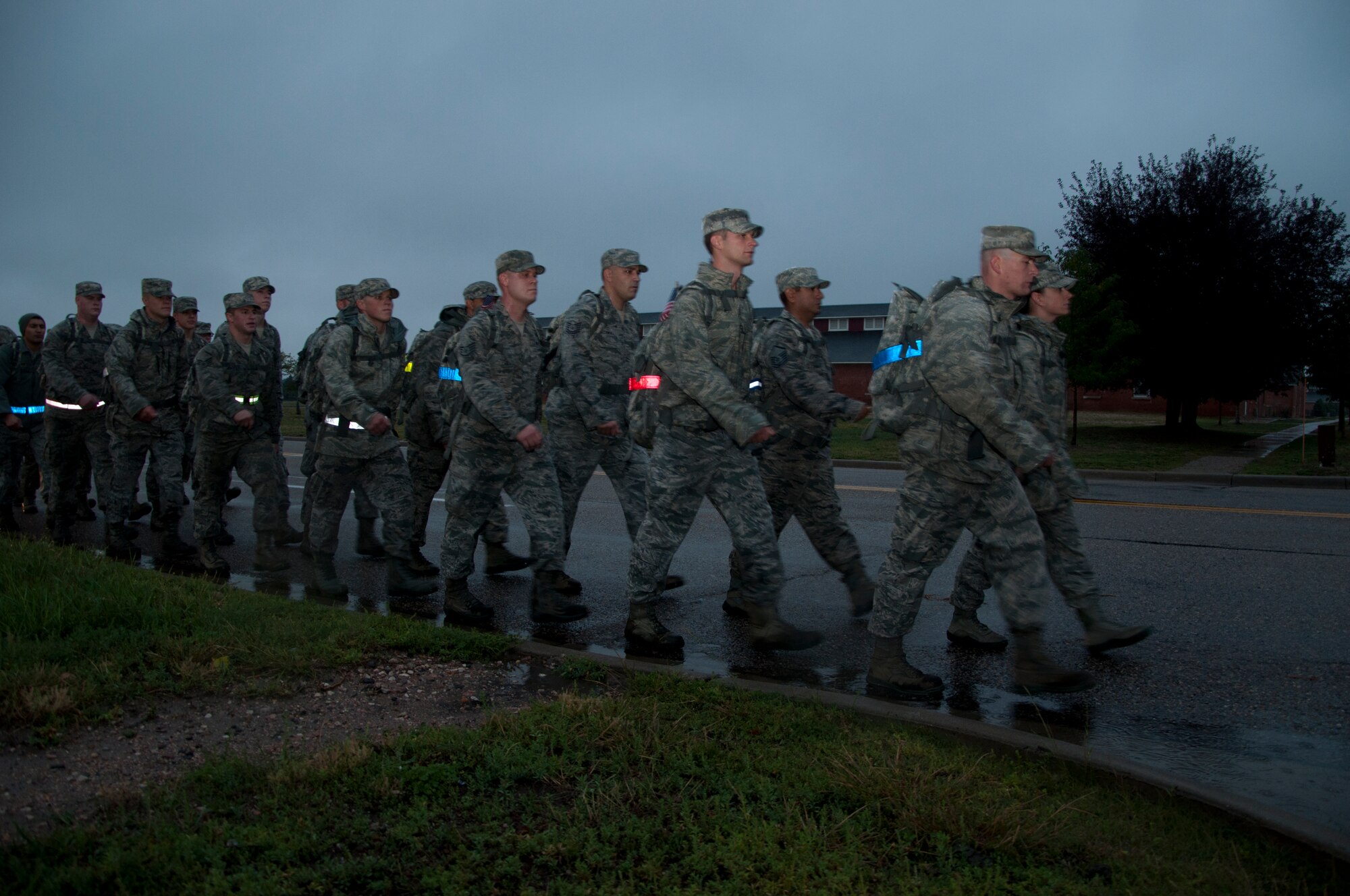 Members of the 90th Logistics Readiness Squadron complete a ruck march in the early morning rain here Sept. 11, 2013. The 3rd annual march began at dawn. Airmen assigned to the squadron filled ruck sacks with sandbags and marched to Warren’s main gate and the base fire department in memory of all first responders lost on 9/11. (U.S. Air Force photo by Tech. Sgt. Stacy Foster, 90th Missile Wing Public Affairs)