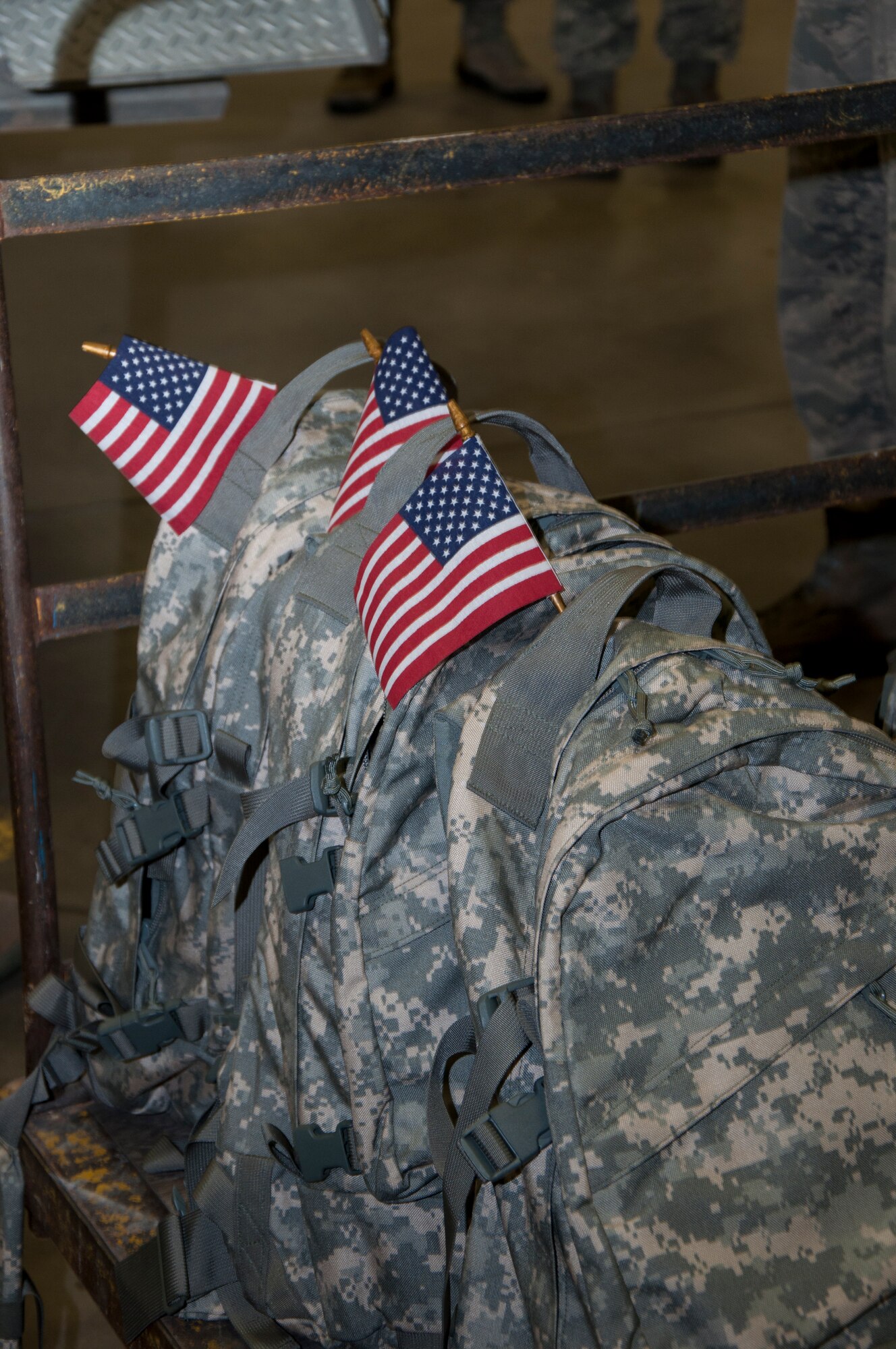 A row of ruck sacks await their Airmen prior to a three-mile ruck march here Sept. 11, 2013. The 3rd annual march, held by the 90th Logistics Readiness Squadron, began at dawn. Airmen assigned to the squadron filled ruck sacks with sandbags and marched to Warren’s main gate and the base fire department in memory of all first responders lost on 9/11. (U.S. Air Force photo by Tech. Sgt. Stacy Foster, 90th Missile Wing Public Affairs)