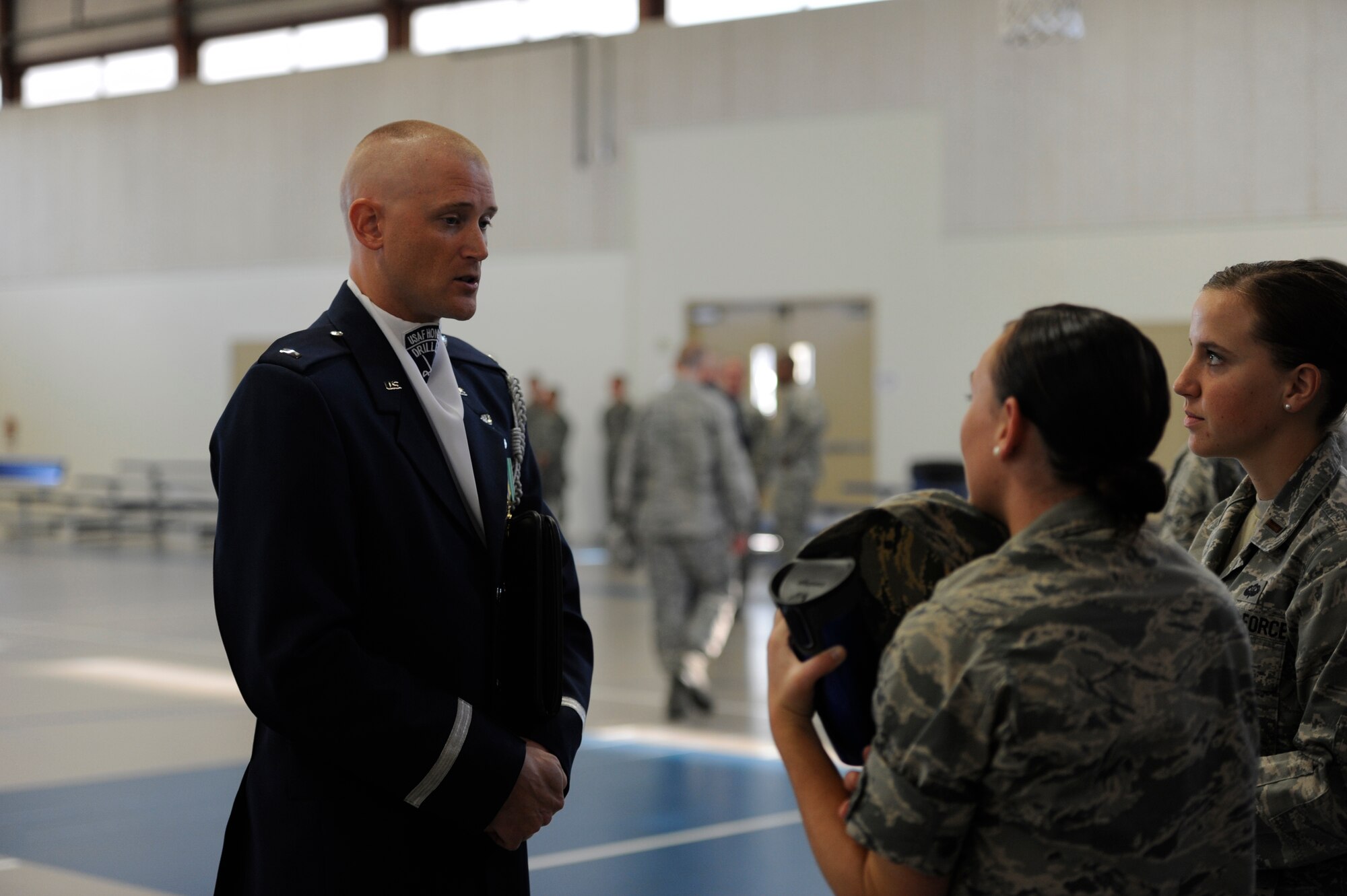 GOODFELLOW AIR FORCE BASE, Texas- 1st Lt. Michael Lemorie, U.S. Air Force Honor Guard Drill Team commander, talks with Team Goodfellow members after performing with the drill team during a recruiting event at the Carswell Field House Sept. 6. The team tours various Air Force bases and community events across the globe, as well as providing performances to thousands visiting the Nation's Capital at various national monuments in Washington, D.C. (U.S. Air Force photo/ Staff Sgt. Austin Knox)