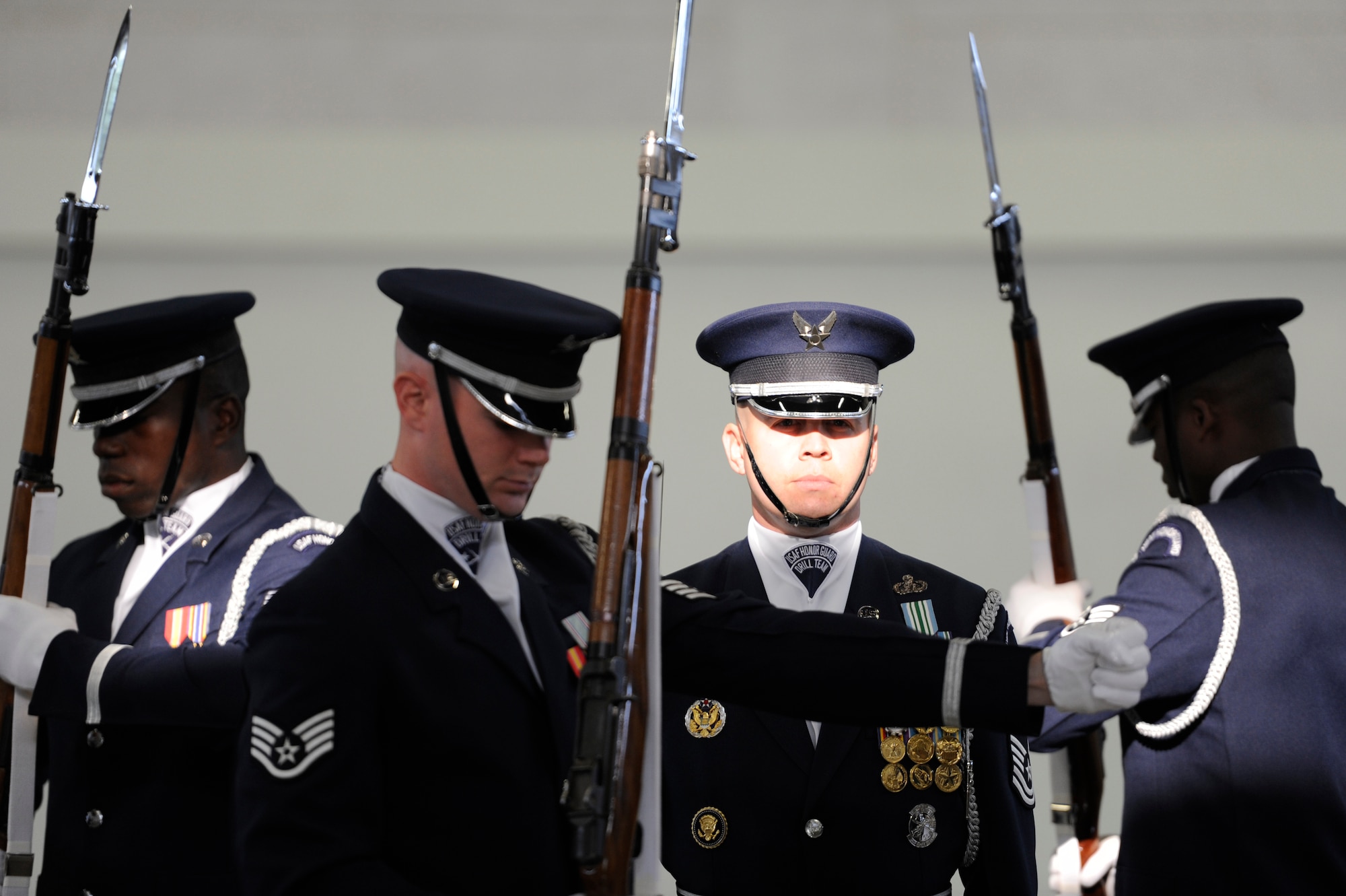 GOODFELLOW AIR FORCE BASE, Texas- The U.S. Air Force Honor Guard Drill Team conducts a drill demonstration for attendees of the recruiting event at the Carswell Field House Sept. 6.  As a matter of heritage, technical drill maneuvers are not written in a manual but passed from one generation of the drill team to another. (U.S. Air Force photo/ Staff Sgt. Austin Knox)
