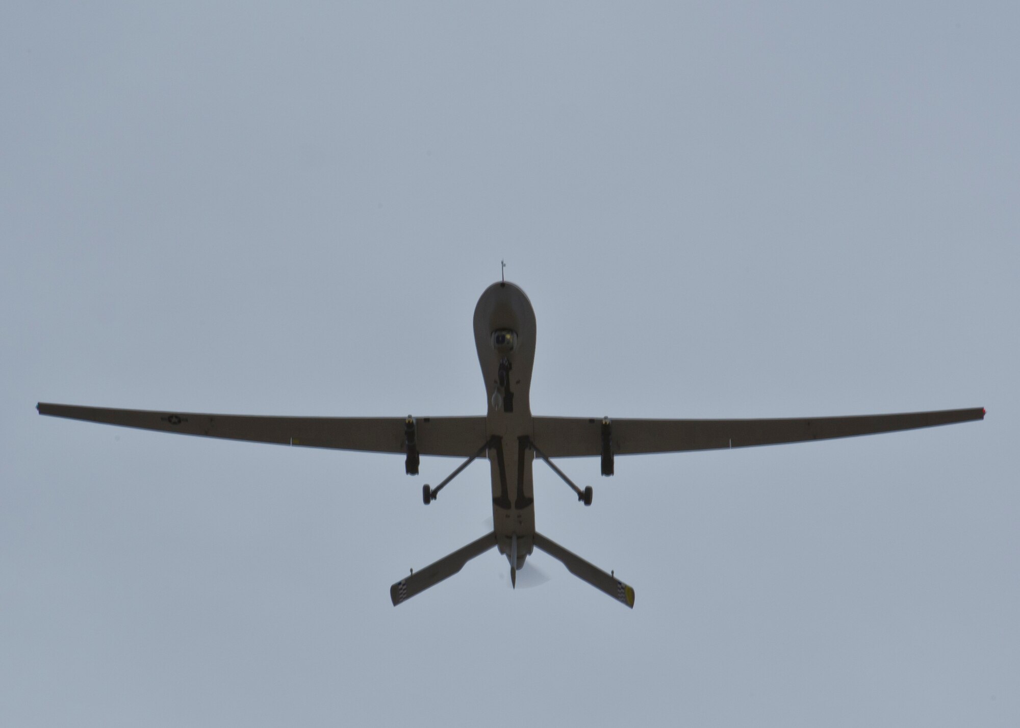 An MQ-1 Predator Remotely Piloted Aircraft prepares to land at Holloman Air Force Base, N.M., June 24. According to the official MQ-1 fact sheet, the Predator is a medium-altitude, long-endurance, unmanned aircraft system. The MQ-1’s primary mission is interdiction and conducting armed reconnaissance against critical, perishable targets. (U.S. Air Force photo by Airman 1st Class Aaron Montoya/Released)