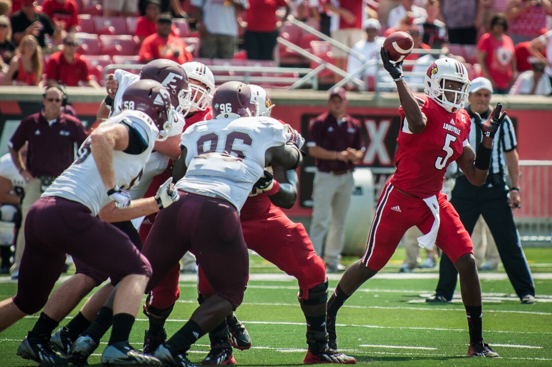 Cardinals quarterback Teddy Bridgewater looks for an open receiver during the University of Louisville-Eastern Kentucky University football game at Papa John’s Cardinal Stadium in Louisville, Ky., Sept. 7, 2013. Billed as Military Appreciation Day, the game featured a number of events to highlight the exceptional service of Kentucky Air National Guardsmen. (U.S. Air National Guard photo by Maj. Dale Greer)