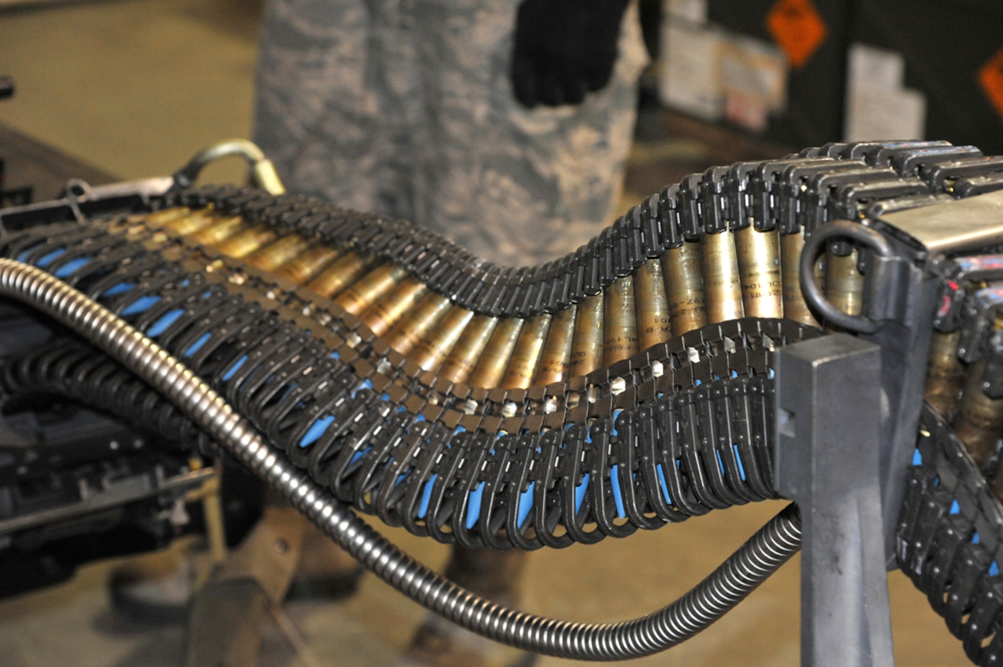 Rounds of 20-millimeter ammunition are loaded into a universal ammunition loading system in the Conventional Maintenance shop on Joint Base Elmendorf-Richardson August 21. Conventional Maintenance is one of the many sections of the 3rd Munitions Squadron that contributes to the loading of ammunition onto F-22 aircraft. (U.S. Air Force photo by Staff Sgt. Blake Mize/Released)