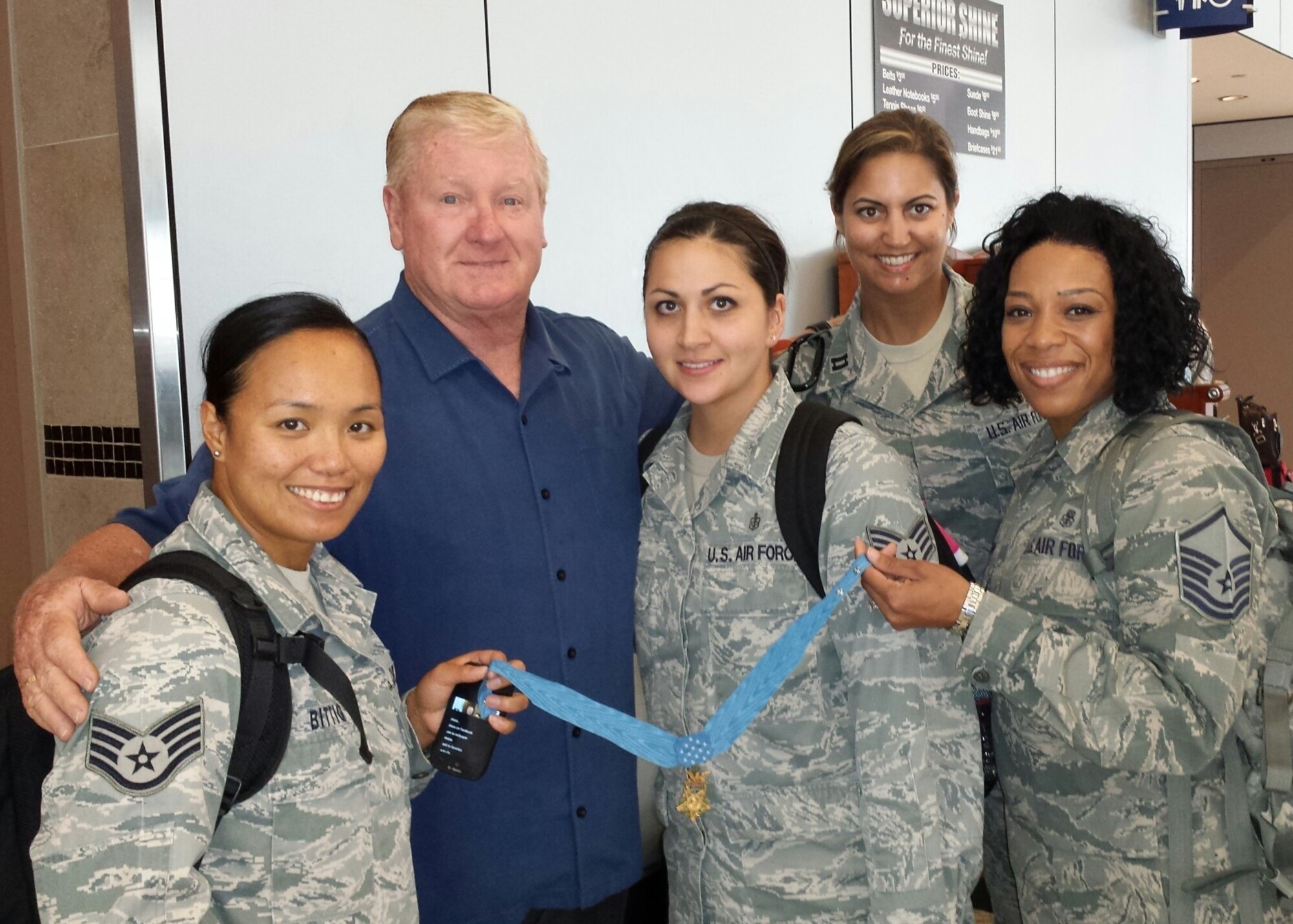 Three members of the 81st Expeditionary Medical Support team had a memorable flight to Indianapolis:  They had the good fortune to be seated next to Medal of Honor recipient Sammy Lee Davis who later “coined” them.  Davis was gracious enough to have his photo taken with the three:  from left, Staff Sgts. Norites Bittig, 81st Dental Squadron; and Cassandra Cruz, 81st Medical Group; and Master Sgt. Mayisha Johnson, 81st Medical Support Squadron, holding his Medal of Honor. Capt. Dawn Higgins, 81st MDSS, joined the trio for the photo. 
 Speaking of the experience, Johnson commented, “It was amazing,” said Johnson. “Most Medal of Honor presentations you see on television are posthumous or you read about them, but this time it was real.  To actually see and touch the medal reminds me of all the military members that have sacrificed for the freedoms in this nation and others who are still sacrificing.  Mr. Davis never told us he was a recipient until we were just about to get off the plane.  When he presented his coin and told us the story, I was still in shock, but I think for Sergeant Bittig took the cake and I think for her, it was a once in a lifetime experience.  Mr. Davis did not have to do what he did by coining us but he did.  And just before he walked away, he thanked us when we should be thanking him.  Next time we look up the ‘Real Forrest Gump,’ we will see his face.”
 According to “Wikipedia,” footage of Davis’ Medal of Honor award ceremony was used in the 1994 film “Forrest Gump” with actor Tom Hanks’ head superimposed on Davis’ body.   (Courtesy photo)