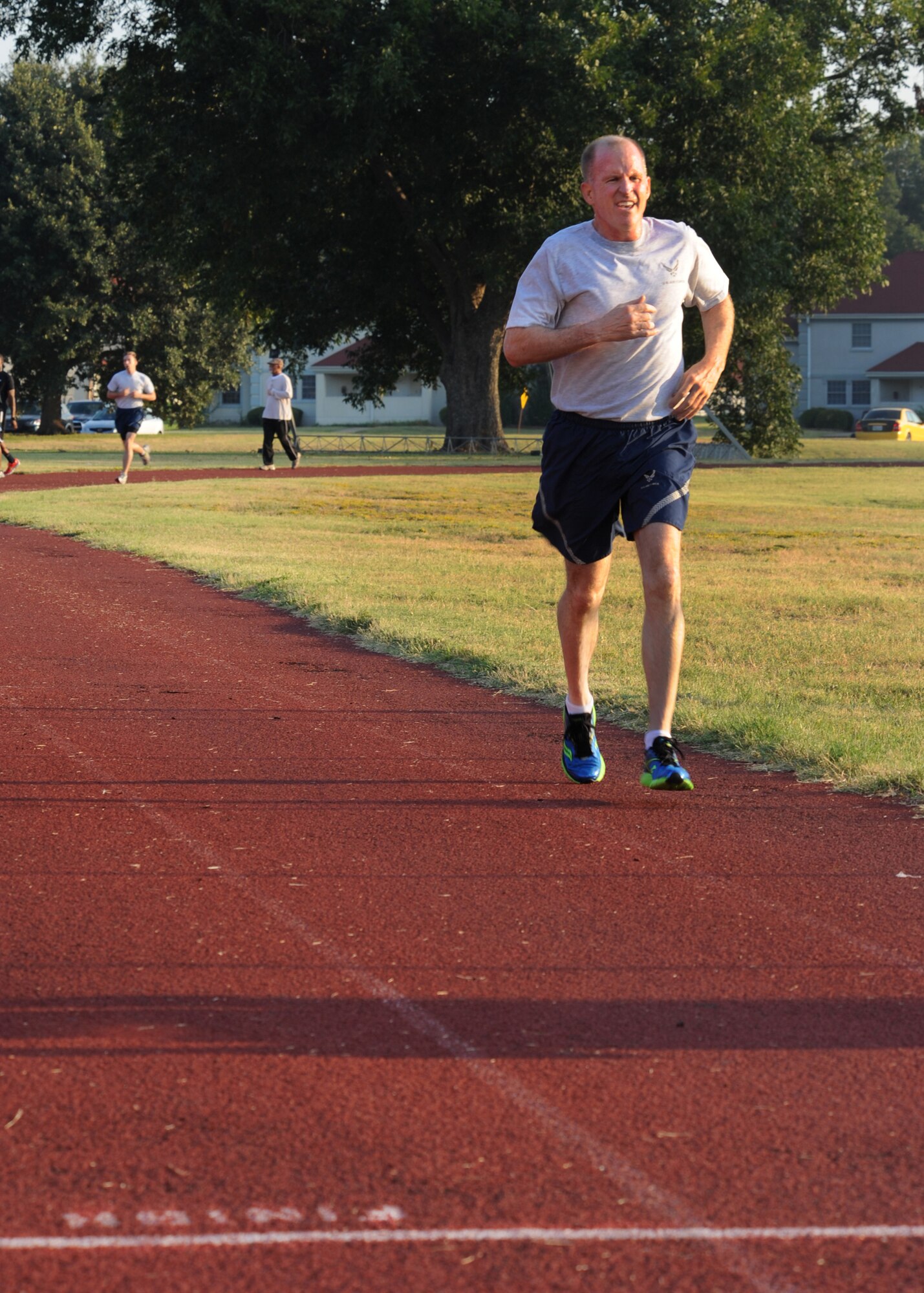 Maj. Gen. Stephen Wilson, 8th Air Force commander, runs around the track at the Senior Airman Bryan Bell Fitness Center on Barksdale Air Force Base, La., Sept. 9, 2013. Wilson, with a total time of 13:38, not only passed his physical training test two and a half minutes sooner, but also ran an additional half-mile to complete and pass the Iron Airman test. (U.S. Air Force photo/Senior Airman Joseph A. Pagán Jr.)