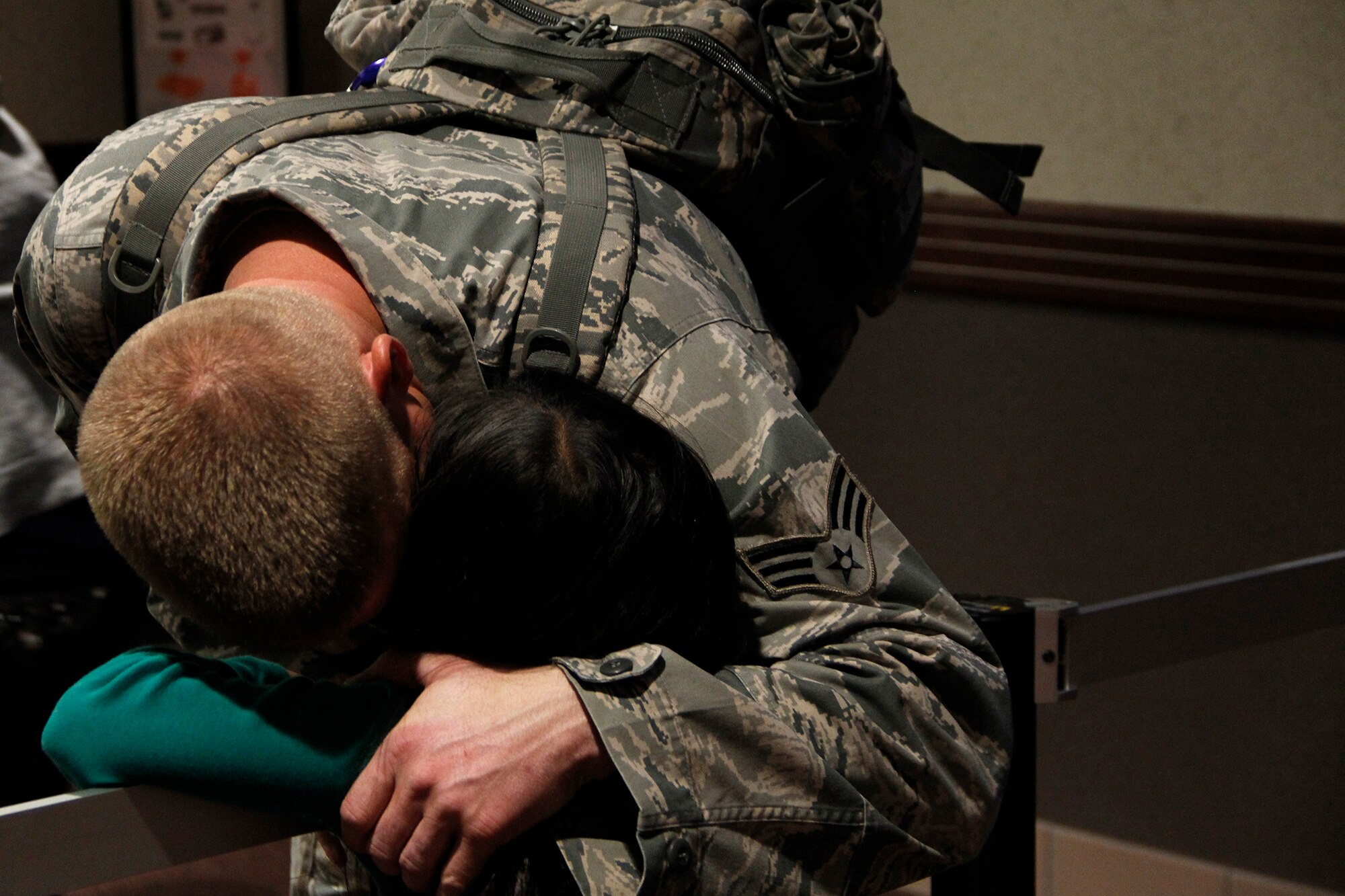 A member of the 39th Aerial Port Squadron embraces his youngest daughter one last time before he goes through security and deploys to Southwest Asia in support of Operation Enduring Freedom. The Airman will provide aerial port operations for approximately the next 180 days at the deployed location. (U.S. Air Force photo/Staff Sgt. Nathan Federico)
