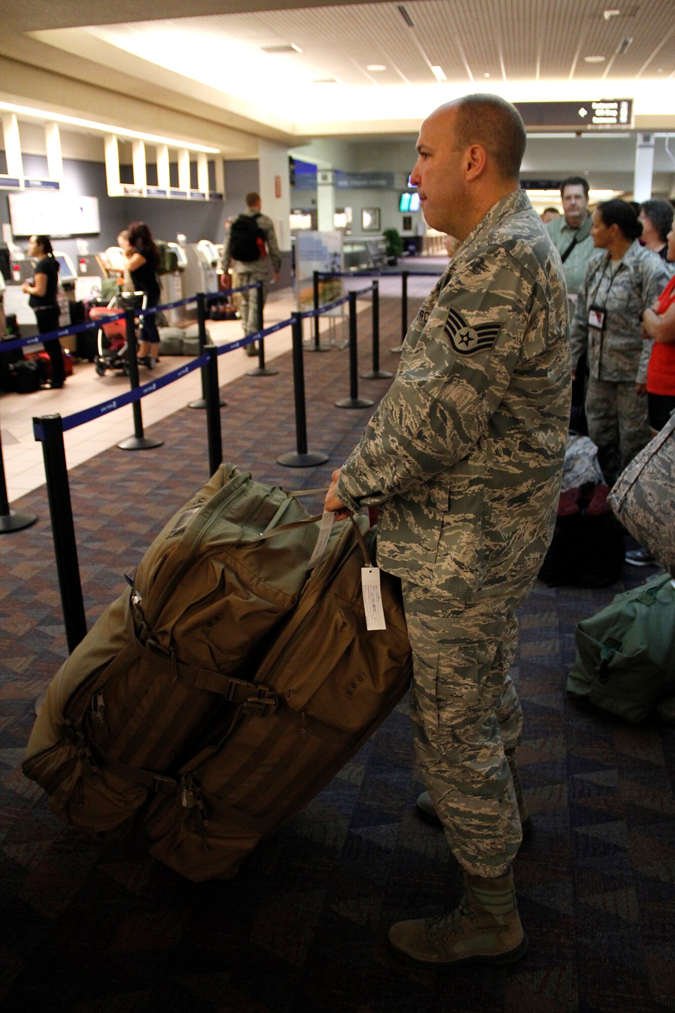 A Reservist assigned to the 39th Aerial Port Squadron, 302nd Airlift Wing, waits in line to check his baggage. He is deploying to Southwest Asia in support of Operation Enduring Freedom. This will be the fourth deployment in support of OEF for the 39th APS since 9/11. (U.S. Air Force photo/Staff Sgt. Nathan Federico)