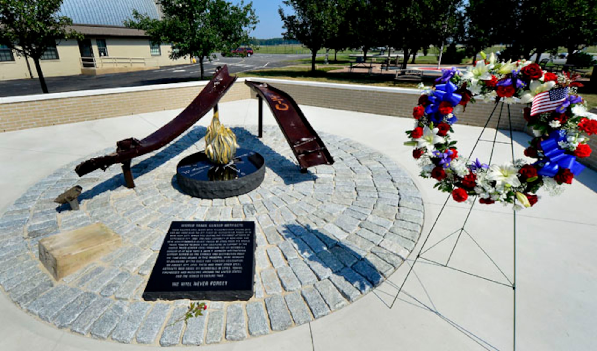 The Sept. 11 Memorial is shown here shortly after the dedication at the Air Mobility Command Museum at Dover Air Force Base, Del., Sept. 11, 2013. The memorial incorporating two pieces of steel from World Trade Center tower one, a rock from the United Airlines Flight 93 crash site and a block from the damaged portion of the Pentagon, was unveiled at the ceremony.  (U.S. Air Force photo/David S. Tucker)