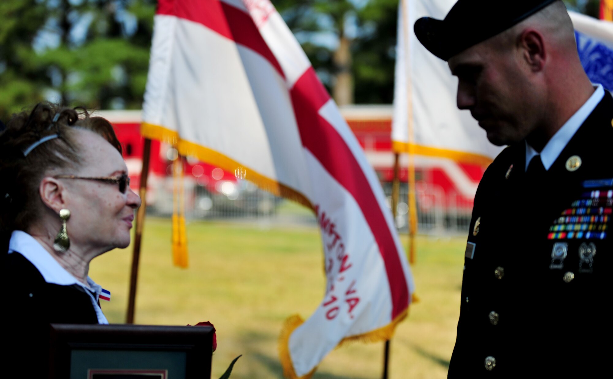 Gloria Murray, left, speaks with U.S. Army 1st Sgt. Ryan Sattelberg, from the 149th Seaport Operations Company, 10th Transportation Battalion, 7th Sustainment Brigade, after a 9/11 remembrance ceremony at Gosnold’s Hope Park, Va., Sept. 11, 2013. Murry, who lost her daughter in the attack on the Pentagon, Washington, D.C., thanked Sattleberg for his service to the nation. (U.S. Air Force photo by Staff Sgt. Jarad A. Denton/Released)