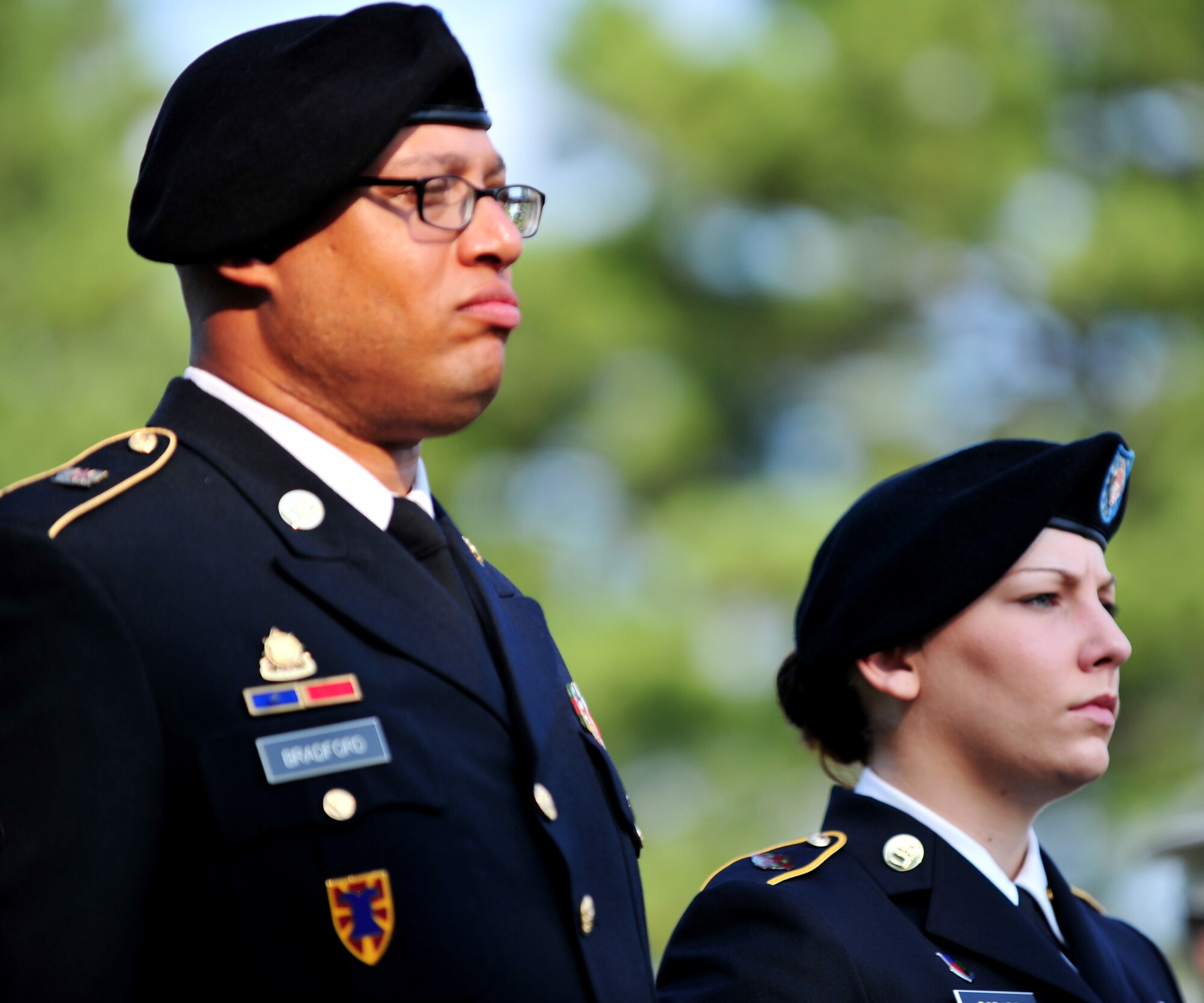 U.S. Army Spc. Adam Bradford, left, from the 149th Seaport Operations Company, 10th Transportation Battalion, 7th Sustainment Brigade, and Spc. Tabbatha Dorado, from the Fort Eustis Dental Clinic, stand at parade rest during a remembrance ceremony at Gosnold’s Hope Park, Va., Sept. 11, 2013. Bradford and Dorado represented the Army during the ceremony, which paid tribute to the victims of the 9/11 terrorist attacks. (U.S. Air Force photo by Staff Sgt. Jarad A. Denton/Released)