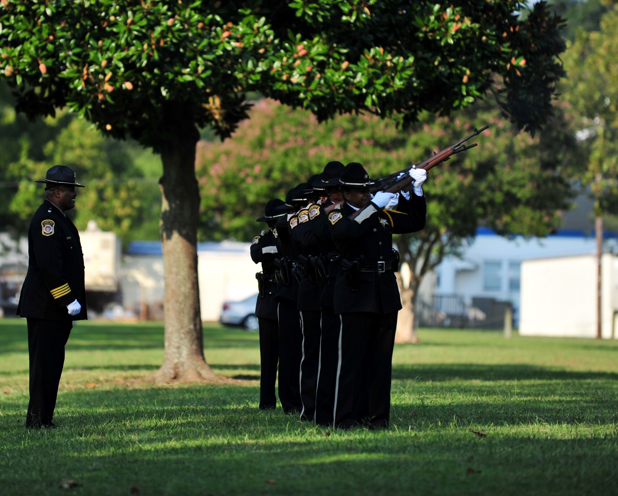 Police officers from the Hampton, Va. Sheriff’s Office rifle team prepare to fire their weapons during a remembrance ceremony at Gosnold’s Hope Park, Sept. 11, 2013. The ceremony paid respects to the victims of the 9/11 terrorist attacks. (U.S. Air Force photo by Staff Sgt. Jarad A. Denton/Released)