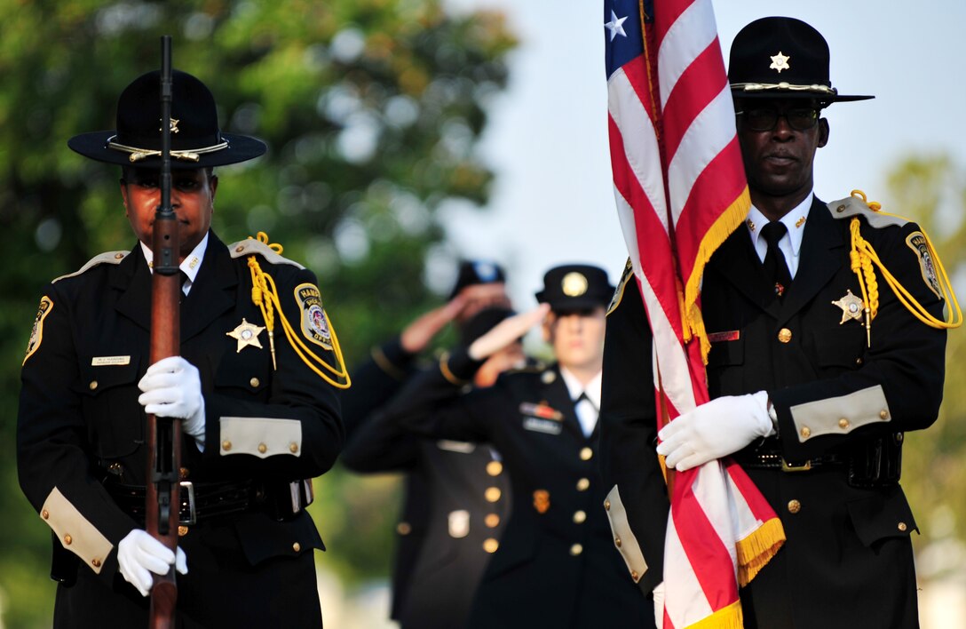 Police officers from the Hampton, Va. Sheriff’s Office rifle team prepare to present the American flag during a remembrance ceremony at Gosnold’s Hope Park, Sept. 11, 2013. The ceremony paid respects to the victims of the Sept. 11 terrorist attacks. (U.S. Air Force photo by Staff Sgt. Jarad A. Denton/Released)