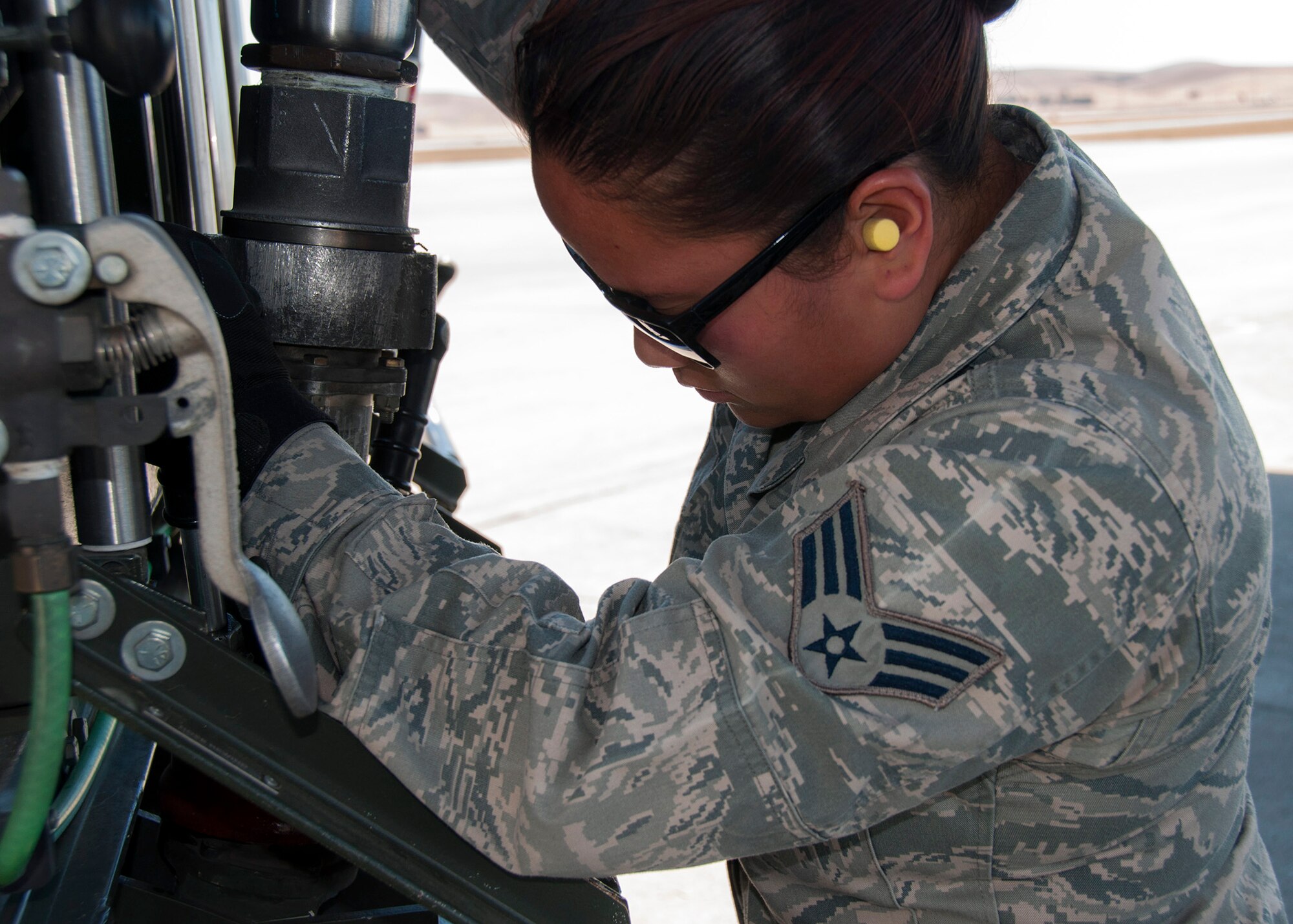 TRAVIS AIR FORCE BASE, Calif. --  Senior Airman Erika Reyrao, 349th Logistics Readiness Squadron, fuels a C-17  Globemaster and receives an important afsc skills certification on Sept. 7, 2013 at Travis Air Force Base, Calif.The 349th Air Mobility Wing's weekend-long specialty skills training event engaged more than 500 Reserve Airmen in hands-on training in the wing's core missions of moving passengers and cargo, generating sorties, flying aircraft, defending the base and providing high-quality medical care. This cost-saving training event fostered communication between units and enhanced esprit de corps. (U.S. Air Force photo/ Senior Airmen Amelia Leonard)
