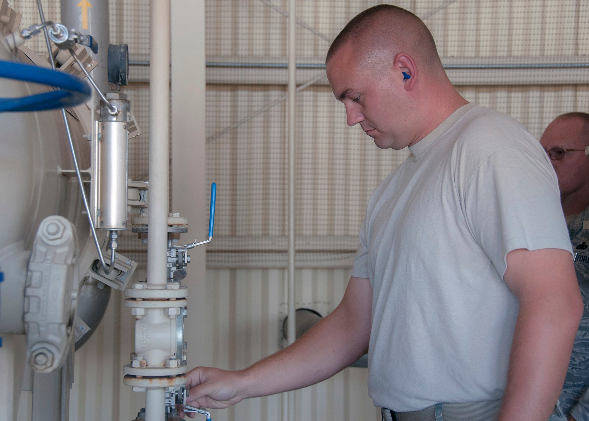 TRAVIS AIR FORCE BASE, Calif. --  Senior Airman Jonathan Litvinchuk, 349th Logistics Readiness Squadron, inspects the fuel pump house on Sept. 7, 2013 at Travis Air Force Base, Calif. The 349th Air Mobility Wing's weekend-long specialty skills training event engaged more than 500 Reserve Airmen in hands-on training in the wing's core missions of moving passengers and cargo, generating sorties, flying aircraft, defending the base and providing high-quality medical care. This cost-saving training event fostered communication between units and enhanced esprit de corps. (U.S. Air Force photo/ Senior Airmen Amelia Leonard)