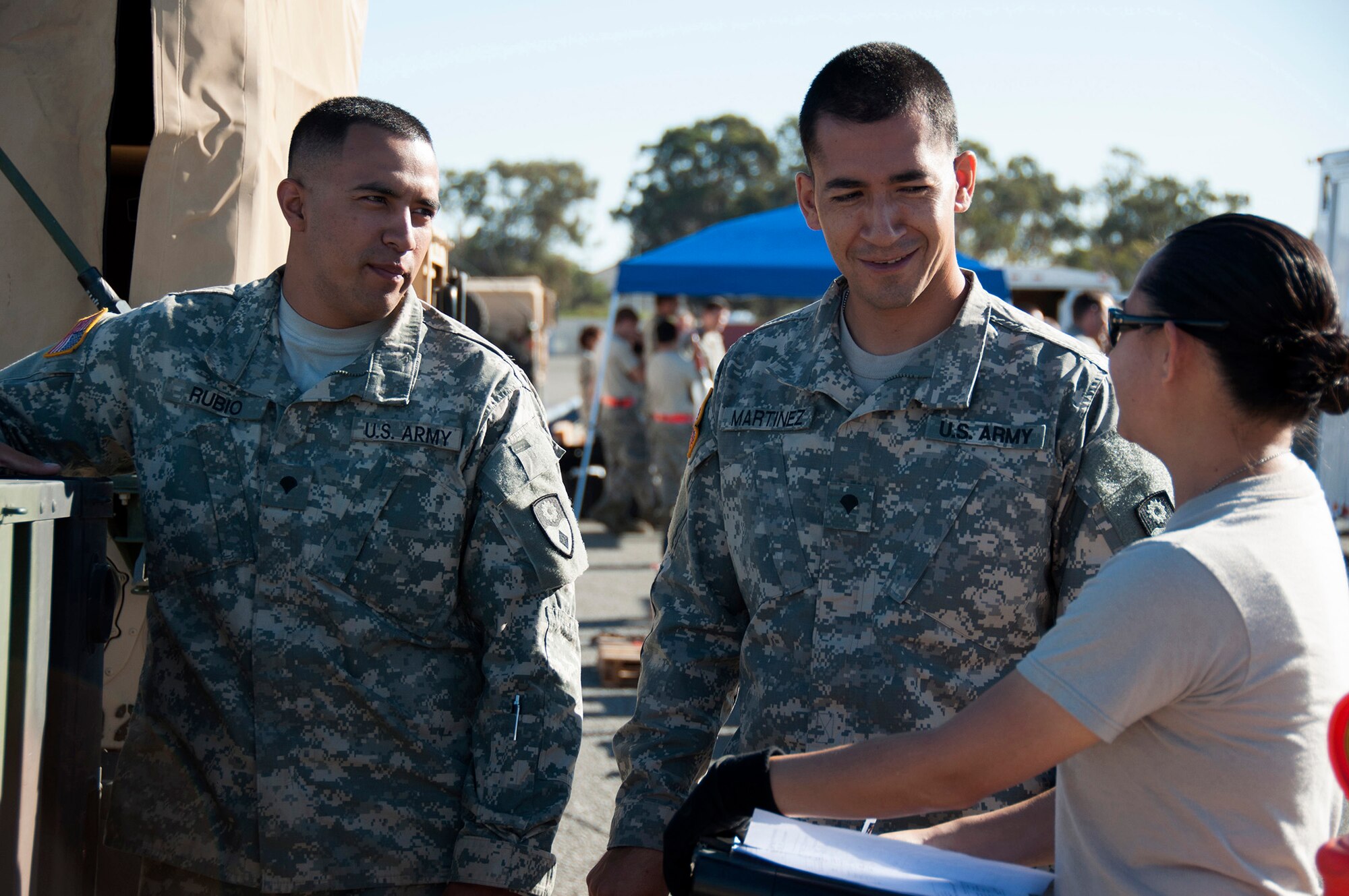 TRAVIS AIR FORCE BASE, Calif. --   Specialist Damien Rubio and Juan Martinez, 149th Chemical Company, and Staff Sgt. MaryKathleen Olaes, 45th Aerial Port Squadron, work together to prepare and inspect cargo during a joint exercise on Sept. 7, 2013 at Travis Air Force Base, Calif.  The 349th Air Mobility Wing's weekend-long specialty skills training event engaged more than 500 Reserve Airmen in hands-on training in the wing's core missions of moving passengers and cargo, generating sorties, flying aircraft, defending the base and providing high-quality medical care. 
This cost-saving training event fostered communication between units and enhanced
esprit de corps. (U.S. Air Force photo/ Senior Airmen Amelia Leonard) 