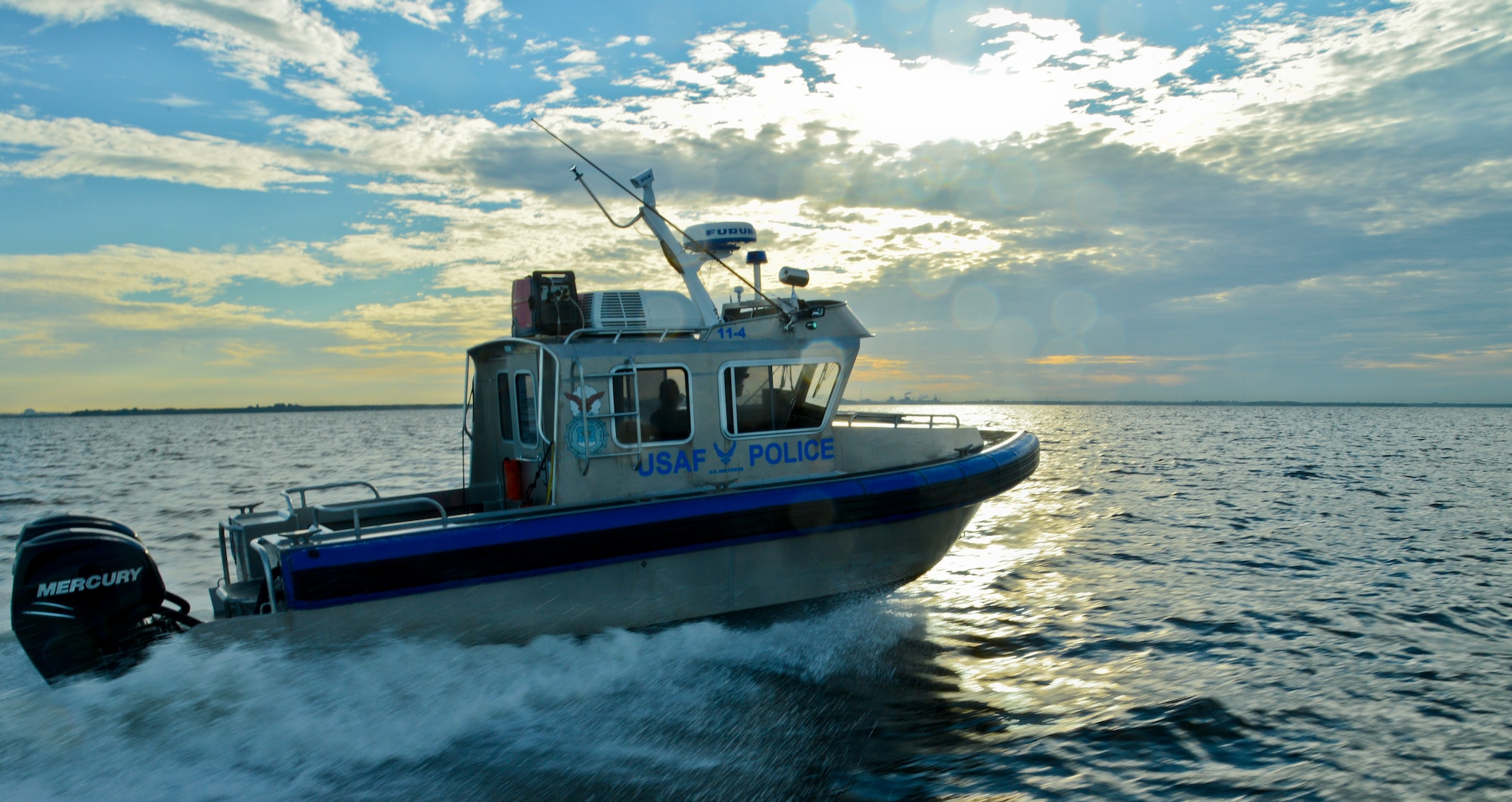 A 6th Security Forces Squadron marine patrol boat speeds off to a call at MacDill Air Force Base, Fla., Sept. 5, 2013. Marine patrol ensures safe borders around MacDill’s coastline and other restricted waterways. (U.S. Air Force photo by Airman 1st Class Ned T. Johnston/Released)