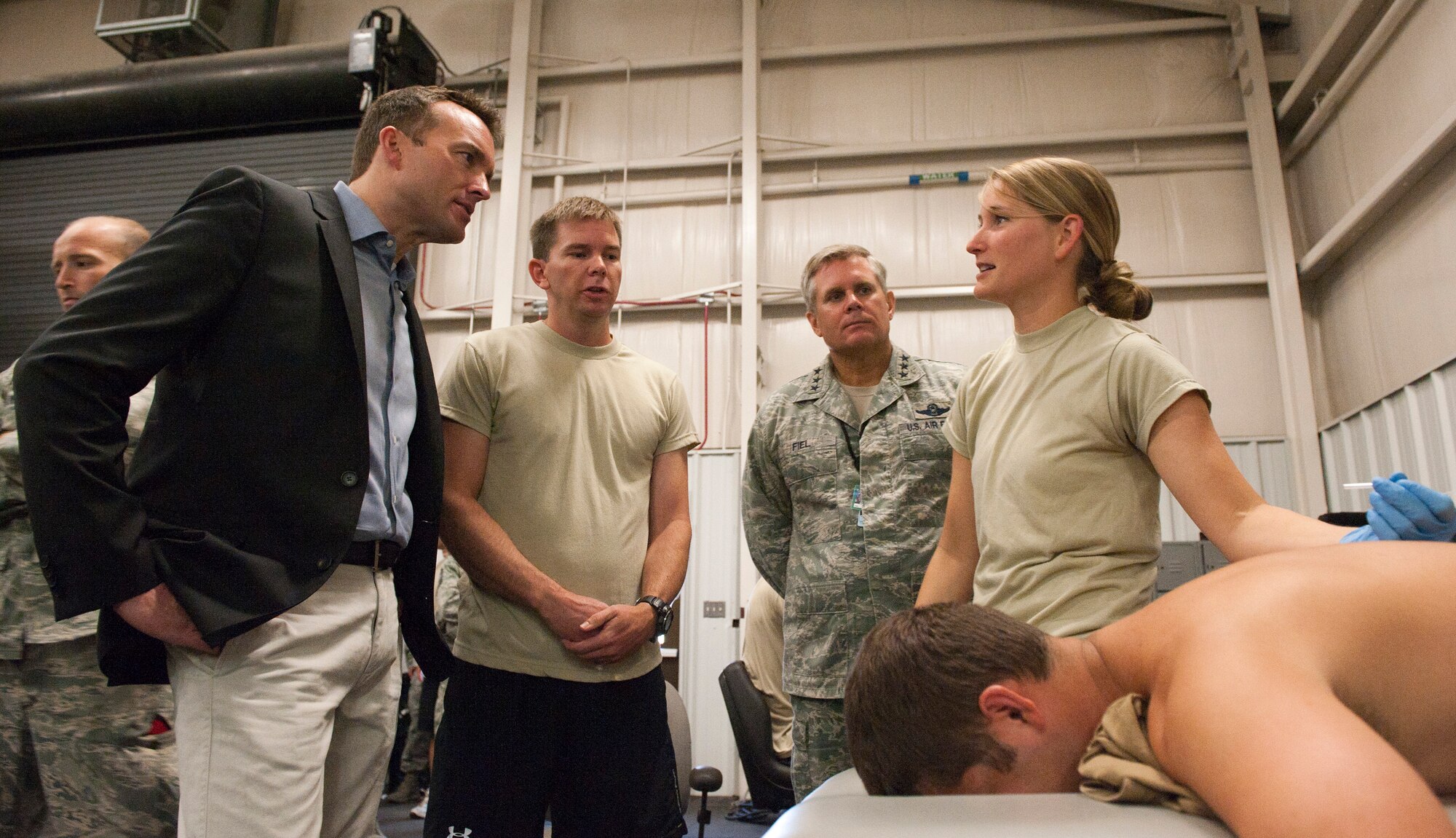 Capt. Danielle Schnitker, 23rd Special Tactics Squadron physical therapist, speaks with Acting Secretary of the Air Force Eric Fanning about physical therapy treatment at Hurlburt Field, Fla., Sept. 10, 2013. This is Fanning’s first visit to the area since he assumed office June 21, 2013. (U.S. Air Force photo/Senior Airman Krystal M. Garrett)