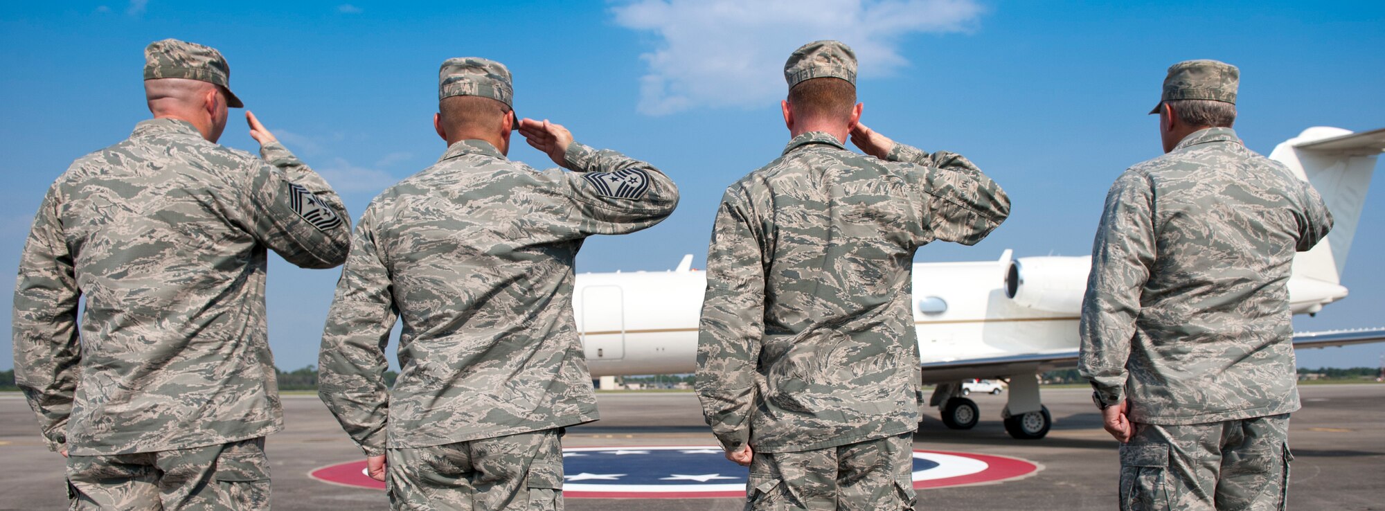 Air Force Special Operations Command and 1st Special Operations Wing leadership salute Acting Secretary of the Air Force Eric Fanning’s aircraft upon arrival at Hurlburt Field Fla., Sept. 9, 2013. The visit is part of Fanning’s familiarization with various Air Force missions since becoming the acting secretary. (U.S. Air Force photo/Senior Airman Krystal M. Garrett) 