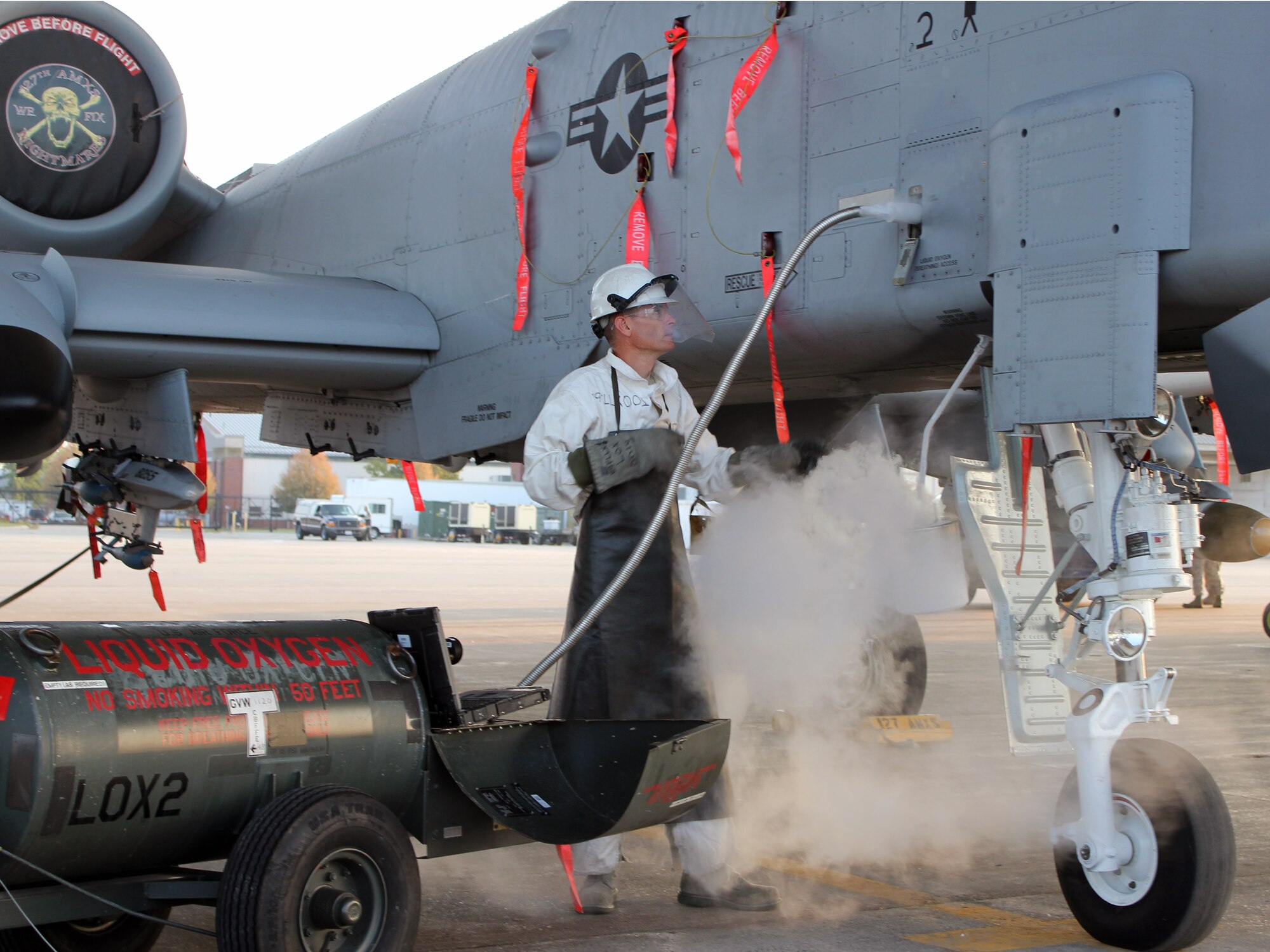 130829-Z-VA676-069 -- Staff Sgt. Scott Dykstra, a crew chief with the 127th Wing, services an A-10 Thunderbolt II with liquid oxygen, or LOX, during routine operations at Selfridge Air National Guard Base, Mich., Aug. 29, 2013. Though the use of LOX is now routine at Selfridge and across the Air Force, it wasn’t until a formation of early “pursuit” planes took off from Selfridge in 1931 that LOX came into general use for military aircraft. (U.S. Air National Guard photo by TSgt. Dan Heaton/Released) 