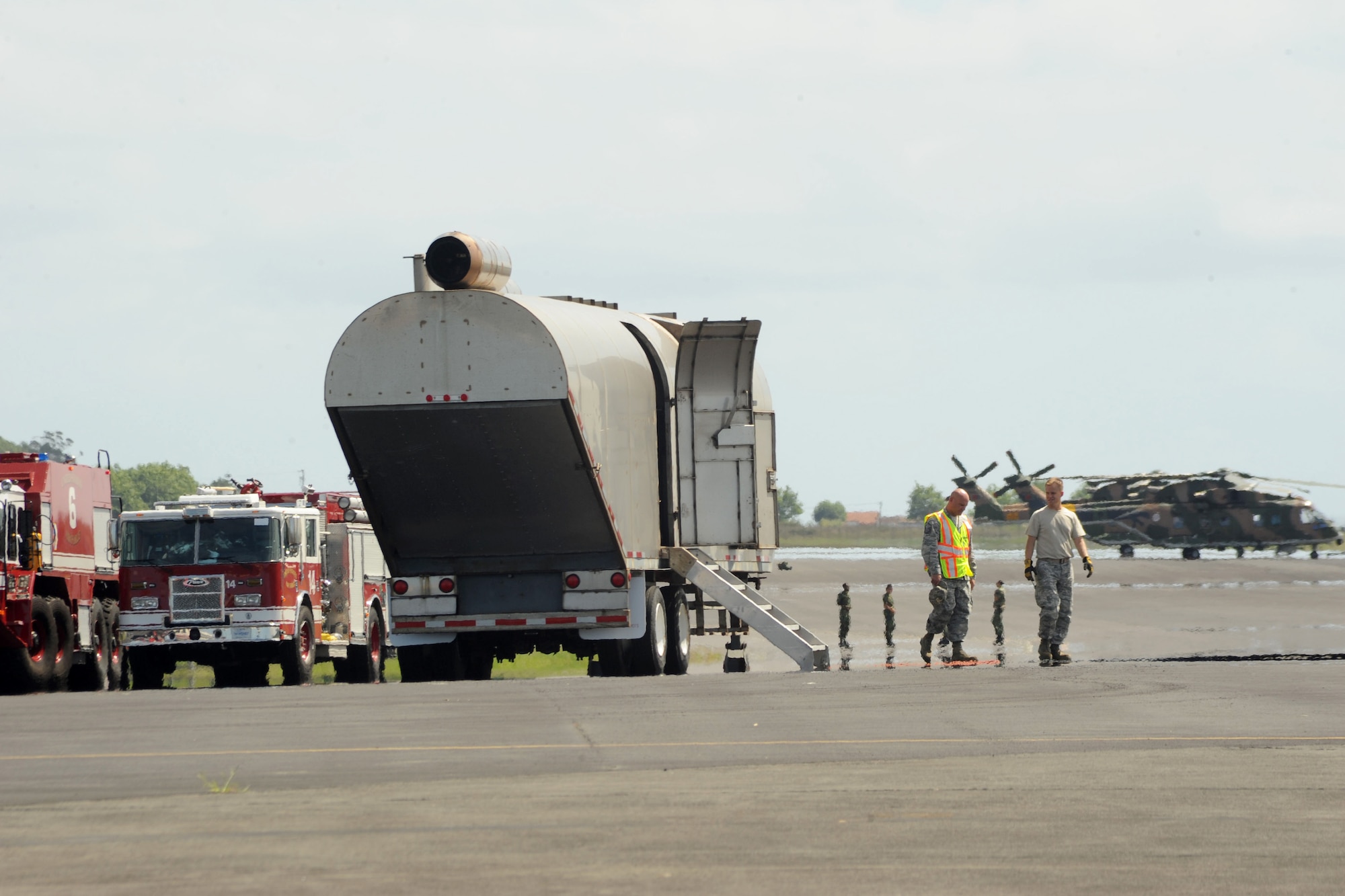 U.S. Air Forces in Europe Inspector General team members and 65th Air Base Wing first responders discuss response procedures during a major accident exercise as part of the wing’s unit effectiveness inspection Sept. 6, 2013, Lajes Field, Azores. The 65th ABW was rated “highly effective,” demonstrating the wing’s ability to execute its mission, measure mission effectiveness and overall compliance.  (U.S. Air Force photo by Guido Melo/Released)