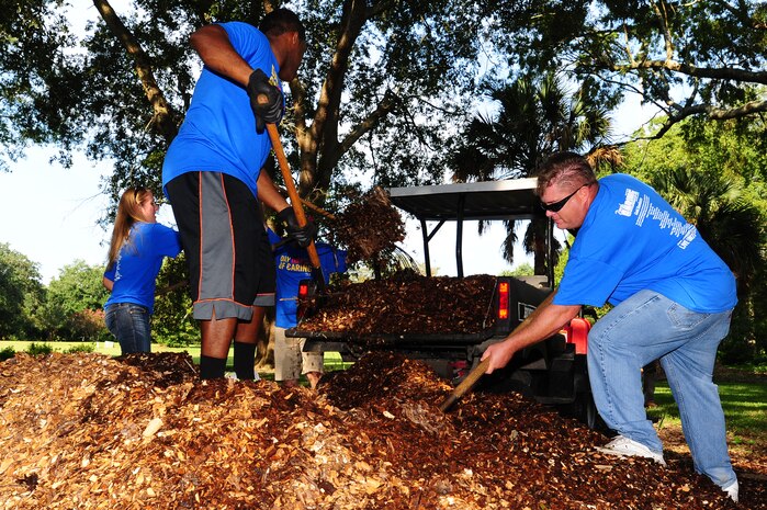 Airmen participate in the annual Trident United Way’s Day of Caring Sept. 6, 2013, at Hampton Park, Charleston, S.C. Approximately 2,500 service members from Joint Base Charleston volunteered their skills to assist with more than 50 projects in the local community. (U.S. Air Force photo/ Airman 1st Class Chacarra Neal)