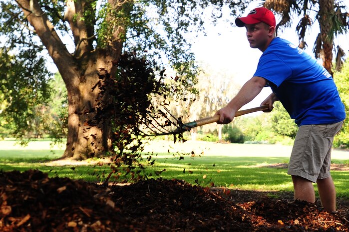 Airmen participate in the annual Trident United Way’s Day of Caring Sept. 6, 2013, at Hampton Park, Charleston, S.C. Approximately 2,500 service members from Joint Base Charleston volunteered their skills to assist with more than 50 projects in the local community. (U.S. Air Force photo/ Airman 1st Class Chacarra Neal)