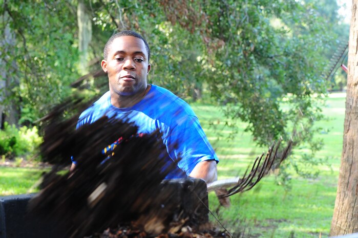 Senior Airman Kelvin Smith, 628th Aerial Medical Squadron, shovels mulch during the annual Trident United Way’s Day of Caring Sept. 6, 2013, at Hampton Park, Charleston, S.C. Approximately 2,500 service members from Joint Base Charleston volunteered their skills to assist with more than 50 projects in the local community. (U.S. Air Force photo/ Airman 1st Class Chacarra Neal)