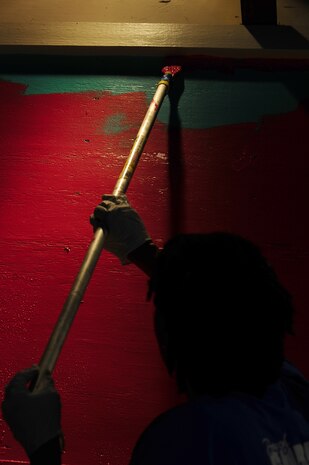 Master Sgt. Lakisha Embery, 315th Maintenance Squadron Non-Destructive Inspections craftsman, paints a wall during the Trident United Way’s Day of Caring Sept. 6, 2013, at the Children's Museum of the LowCountry, Charleston, S.C. Approximately 2,500 service members from Joint Base Charleston volunteered their skills to assist with more than 50 projects in the local community.  
 (U.S. Air Force photo/ Airman 1st Class Chacarra Neal)
