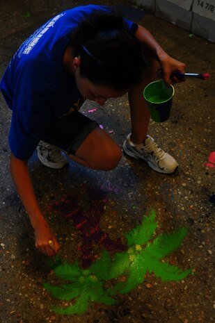 Airmen participate in the annual Trident United Way’s Day of Caring Sept. 6, 2013, at the Children's Museum of the LowCountry, Charleston, S.C. Approximately 2,500 service members from Joint Base Charleston volunteered their skills to assist with more than 50 projects in the local community. (U.S. Air Force photo/ Airman 1st Class Chacarra Neal)