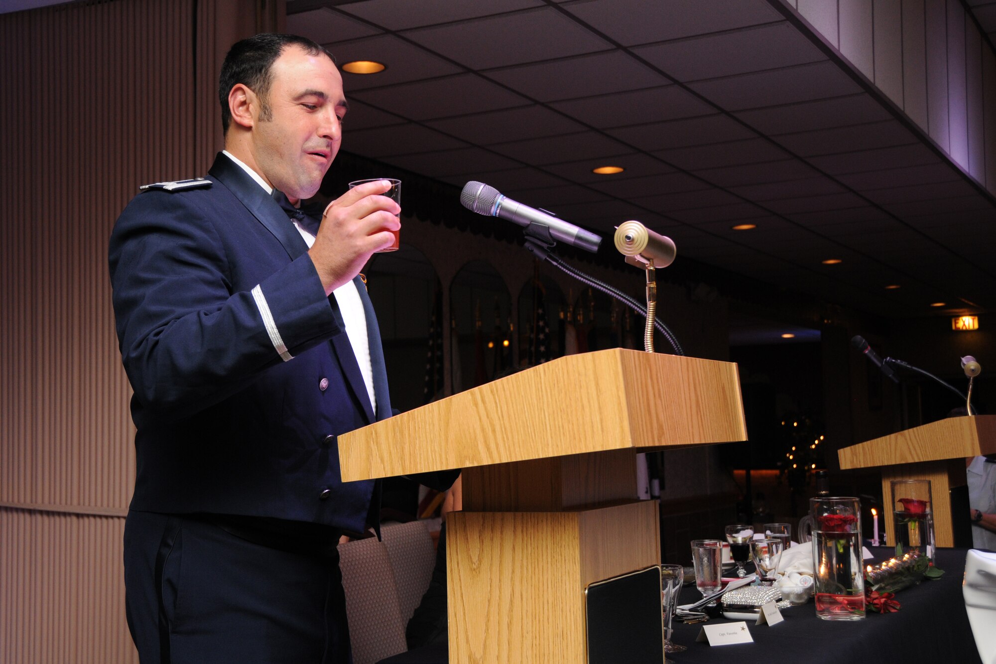 WARREN, Ohio—Captain Rocco Favorite, officer in charge of quality assurance for the 910th Aerial Maintenance Squadron and one of the masters of ceremony for the 910th Airlift Wing’s Air Force Birthday Dining Out, proposes a toast during the 910th Airlift Wing’s Air Force Birthday Dining Out here, Sept. 8. The dining out, steeped in military tradition, was designed to recall Air Force Heritage, boost camaraderie and provide an evening of fellowship in military custom. U.S. Air Force photo by SrA Rachel Kocin.