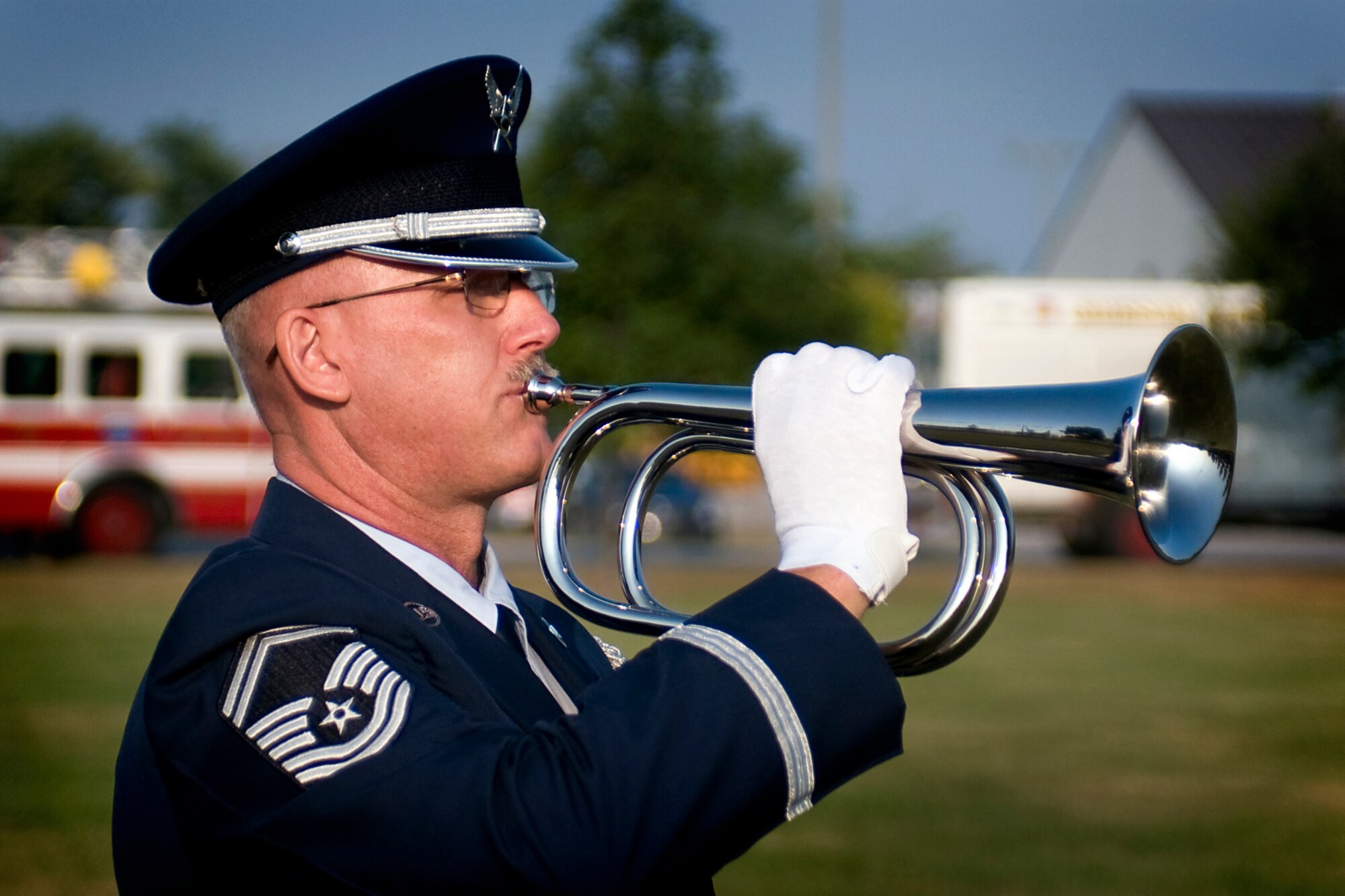 Senior Master Sgt. Timothy Wood, Grissom base honor guard manager, plays Taps during a 9/11 remembrance ceremony at Grissom Air Reserve Base, Ind., Sept. 11, 2013. Wood joined other 434th Air Refueling Wing Airmen and Grissom base personnel at the base flag to remember both those lost in 2001 and those who have given their lives for freedom's sake ever since. (U.S. Air Force photo/Tech. Sgt. Mark R. W. Orders-Woempner) 