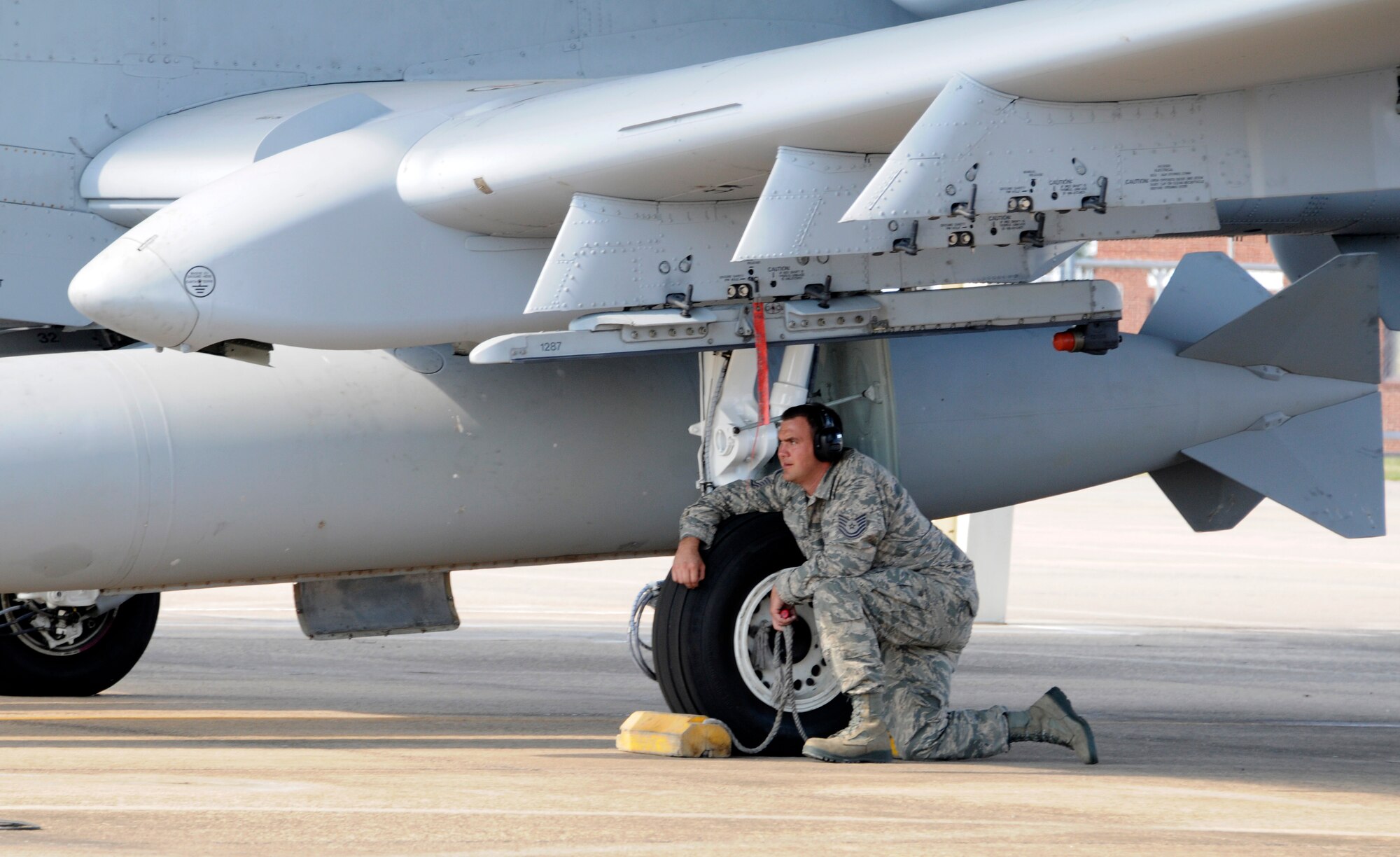 A crew chief with the 188th Aircraft Maintenance Squadron, prepares to remove chalks from an A-10C Thunderbolt II “Warthog,” Sept. 10 at Ebbing Air National Guard Base in Fort Smith, Ark. The pilot of the aircraft flew Tail No. A0614 back to Moody AFB, signaling the beginning of the end for the 188th’s fighter mission. The 188th will lose two Warthogs a month until the last two leave in June 2014. The 188th is in the beginning stages of converting from A-10s to an Intelligence and remotely piloted aircraft mission. The mission, which will feature the MQ-9 Reaper, will also boast the Air National Guard’s only space-focused targeting squadron. (U.S. Air National Guard photo by Senior Airman Hannah Landeros/188th Fighter Wing Public Affairs)