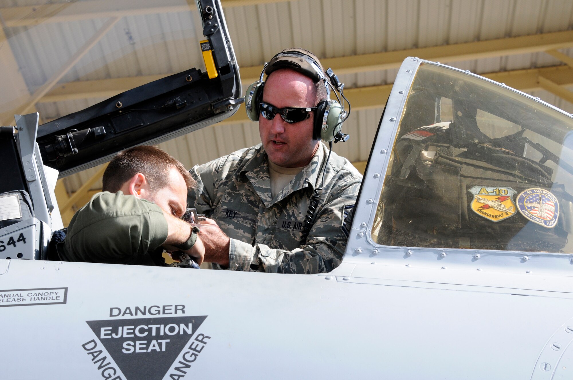 Master Sgt. Haden Key, a crew chief with the 188th Aircraft Maintenance Squadron, straps a pilot inside A-10C Thunderbolt II “Warthog,” Sept. 10 at Ebbing Air National Guard Base in Fort Smith, Ark. The pilot, a member of Moody Air Force Base’s 75th Fighter Squadron, flew Tail No. A0644 back to Georgia, signaling the beginning of the end for the 188th’s fighter mission. The 188th will lose two Warthogs a month until the last two leave in June 2014. The 188th is in the beginning stages of converting from A-10s to an Intelligence and remotely piloted aircraft mission. The mission, which will feature the MQ-9 Reaper, will also boast the Air National Guard’s only space-focused targeting squadron. (U.S. Air National Guard photo by Senior Airman Hannah Landeros/188th Fighter Wing Public Affairs)