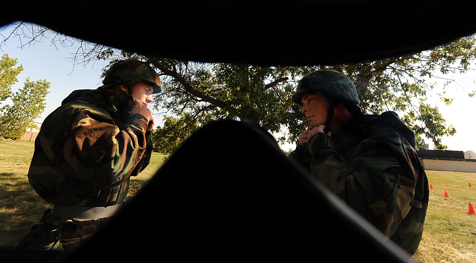 Airmen from the 5th Aircraft Maintenance Squadron participate in a general task qualification training course during an exercise at Minot Air Force Base, N.D., Sept. 5. More than 100 personnel from the 5th Maintenance Group were trained on various tactical techniques and procedures, including donning their chemical warfare ensemble; hydrating in Mission Oriented Protective Posture 4; performing an unexploded ordnance sweep; applying contamination avoidance techniques, and processing through mock contamination controlled areas. (U.S. Air Force photo/Senior Airman Stephanie Sauberan)