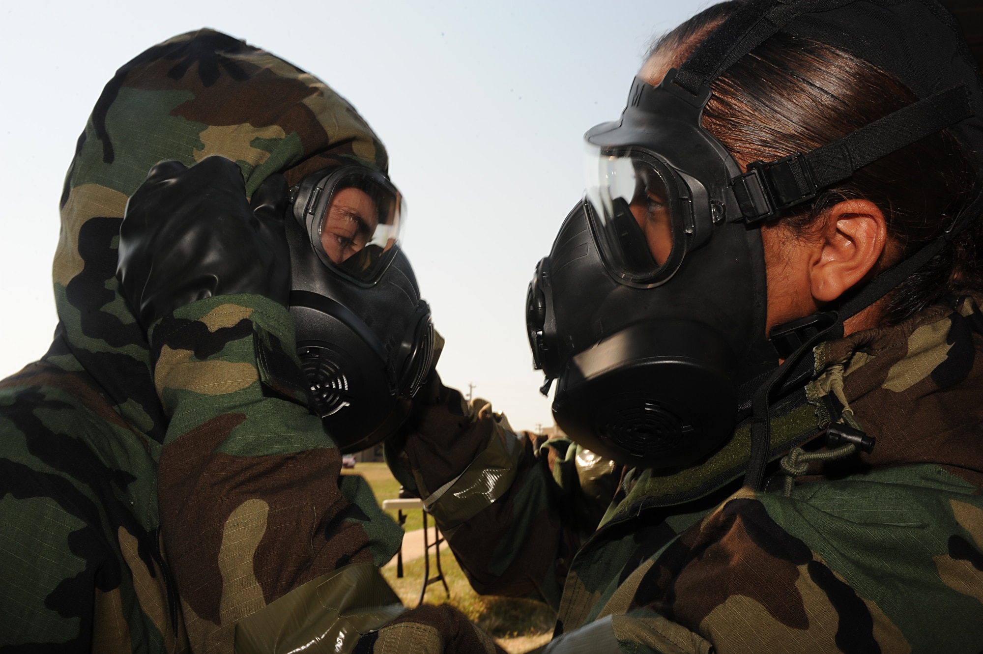 Airmen from the 5th Aircraft Maintenance Squadron participate in a general task qualification training course during an exercise at Minot Air Force Base, N.D., Sept. 5. More than 100 personnel from the 5th Maintenance Group were trained on various tactical techniques and procedures, including donning their chemical warfare ensemble; hydrating in Mission Oriented Protective Posture 4; performing an unexploded ordnance sweep; applying contamination avoidance techniques, and processing through mock contamination controlled areas. (U.S. Air Force photo/Senior Airman Stephanie Sauberan)