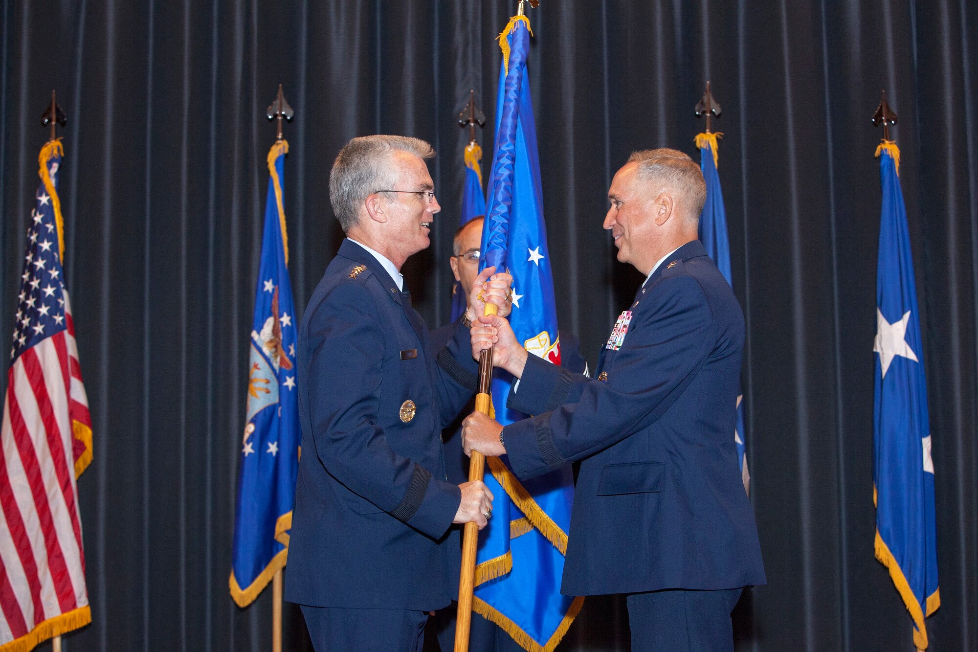 Maj. Gen. Frederick “Rick” Martin assumed command of the U.S. Air Force Expeditionary Center during a ceremony Sept. 9, 2013, at the Expeditionary Center, here. General Paul J. Selva, Air Mobility Command commander, Scott Air Force Base, Ill., presided over the event, attended by nearly 200 service members, family members and honored guests from across the joint base.  (U.S. Air Force photo by Wayne Russell/Released)