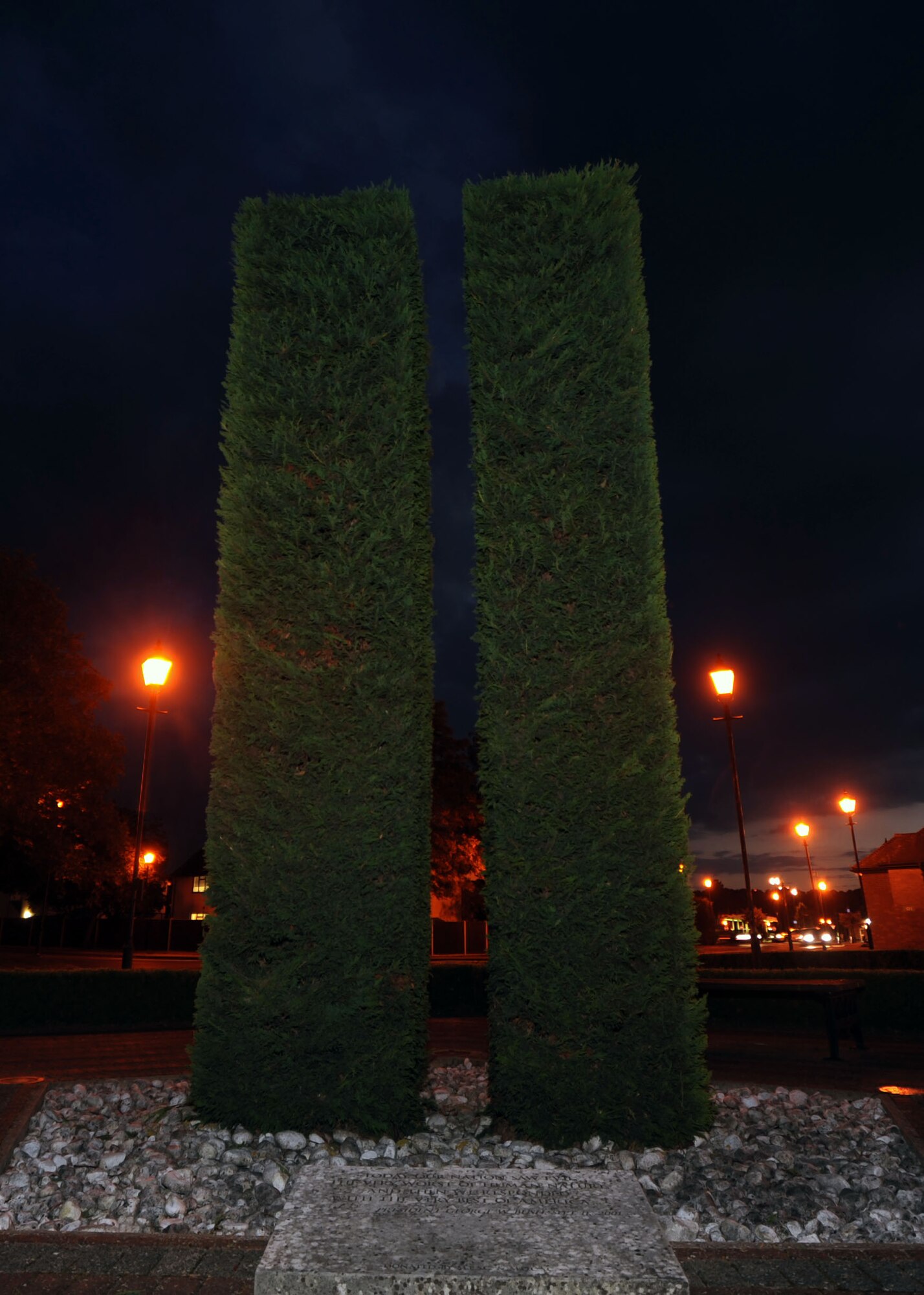 A memorial outside the Bob Hope Community Center on RAF Mildenhall, England, serves as a reminder of those who were lost on 9/11. Almost 3,000 people died during the attacks. This photo the memorial at night is a reminder of the 12th anniversary of the attacks. (U.S. Air Force photo by Airman 1st Class Preston Webb/Released)
