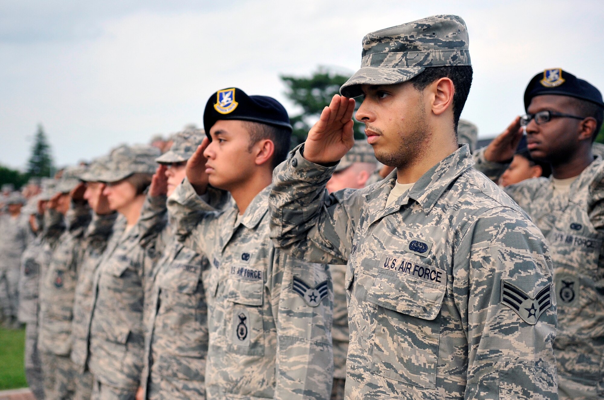 First responders from the 35th Civil Engineer Squadron, 35th Security Forces Squadron and the 35th Medical Group salute during the Patriot Day Retreat Ceremony at Misawa Air Base, Japan, Sept. 11, 2013. The ceremony served as a time to honor and pay respect to the victims and first responders who lost their lives in the 9/11 terrorist attacks that happened 12 years ago. (U.S. Air Force photo by Airman 1st Class Zachary Kee)