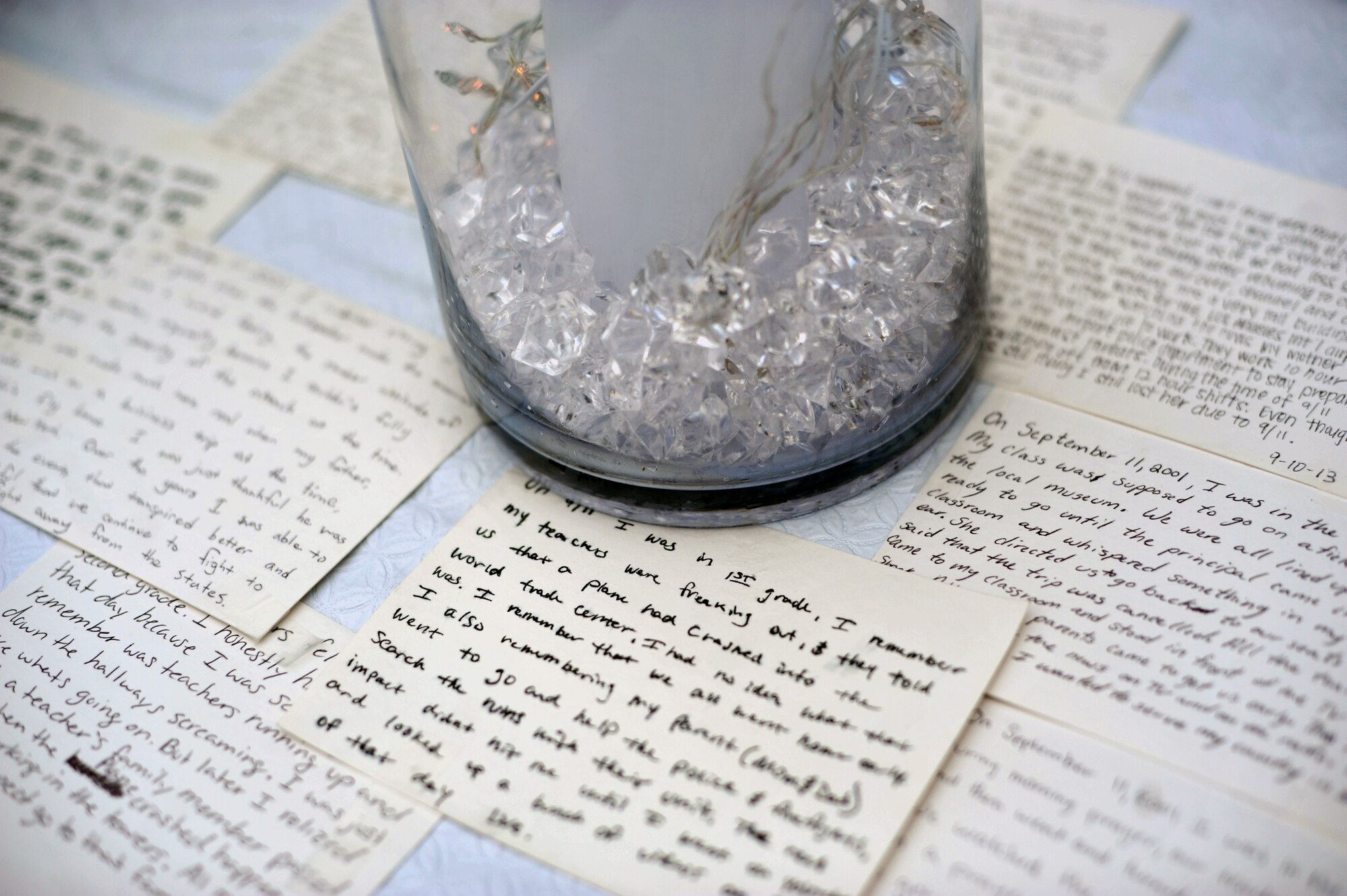 Index cards that were written by Airmen lay on a table as part of a display for the 9/11 memorial ceremony at Osan Air Base, Republic of Korea, Sept. 11, 2013. Different Osan Airmen wrote their accounts and memories of 9/11 on the index cards that were shared for all to read. (U.S. Air Force photo/Senior Airman Siuta B. Ika)