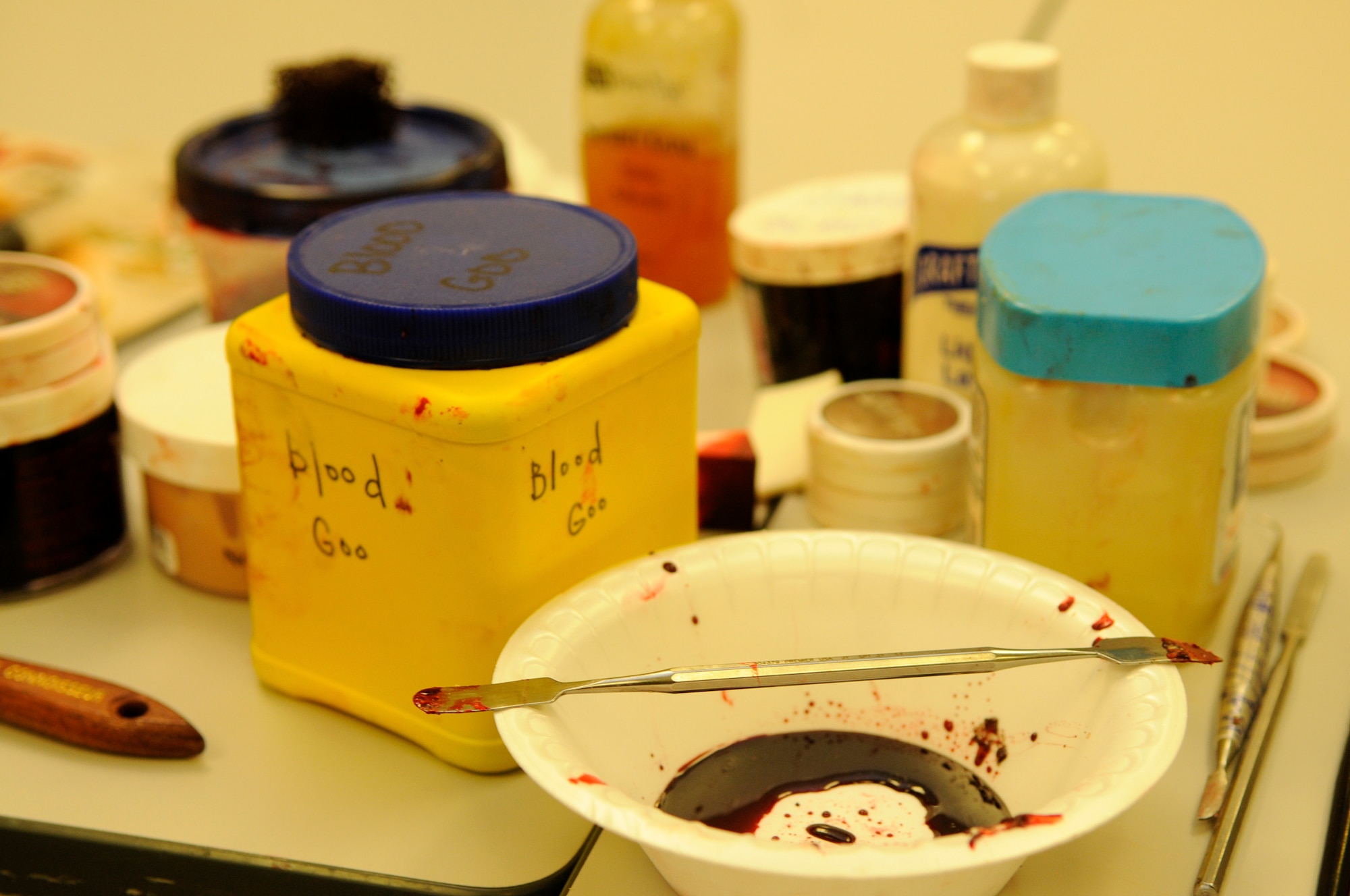 Make-up, clay and fake blood are just some of the items the 18th Medical Group uses for moulage during a local operational readiness exercise on Kadena Air Base, Japan, Sept. 11, 2013. Moulage is the art of applying mock injuries for the purpose of training emergency response teams and other medical and military personnel. (U.S. Air Force photo by Senior Airman Marcus Morris)