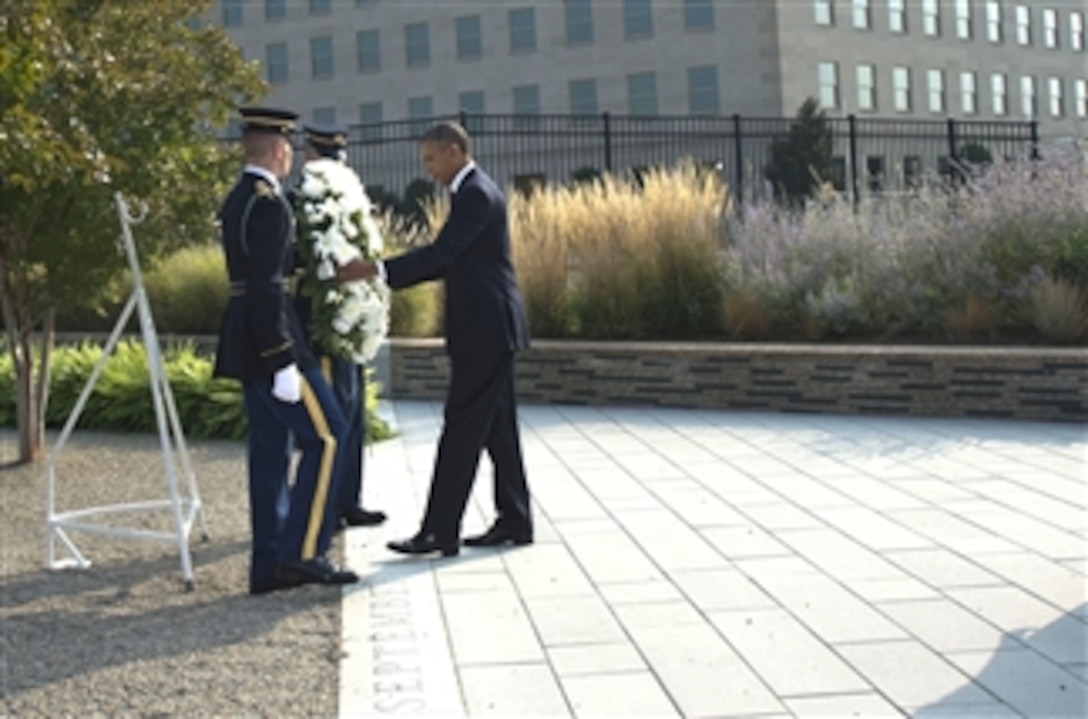 President Barack Obama places a wreath at the dateline of the Pentagon 9/11 Memorial during a remembrance ceremony to honor the victims of the 9/11 attacks on the Pentagon in Arlington, Va., on Sept. 11, 2013.  The president joined Secretary of Defense Chuck Hagel, Chairman of the Joint Chiefs of Staff Gen. Martin Dempsey and family members of those killed in the terrorist attack twelve years ago to remember and mark the anniversary.  