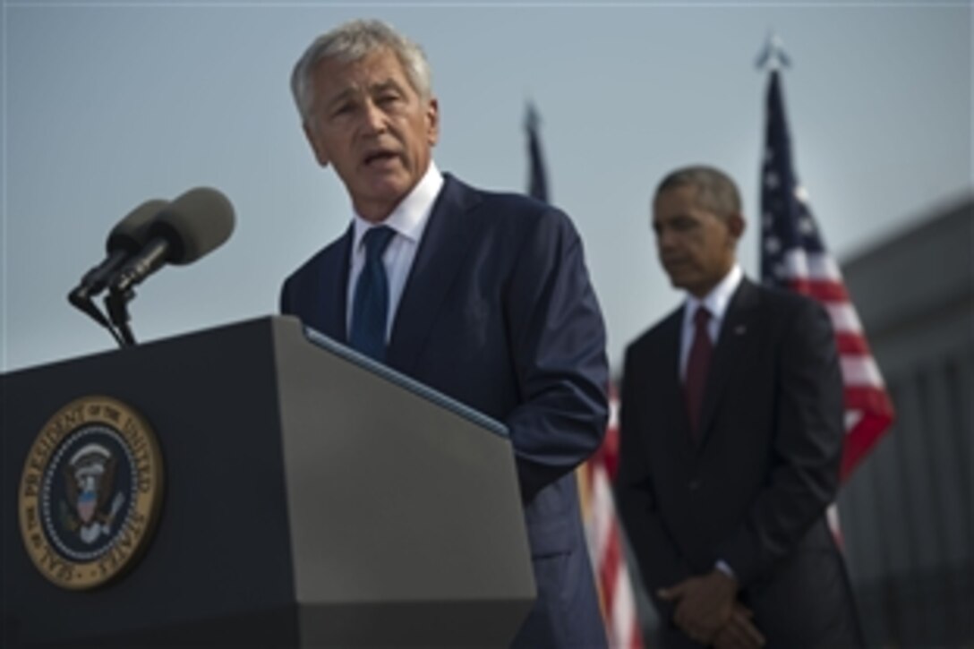 Defense Secretary Chuck Hagel offers remarks during a remembrance ceremony to honor the victims of the 9/11 attacks on the Pentagon at the Pentagon Memorial, Sept. 11, 2013. Hagel, President Barack Obama, right, and Army Gen. Martin E. Dempsey, (not pictured), chairman of the Joint Chiefs of Staff, spoke at the event for family members of those killed in the terrorist attack twelve years ago.