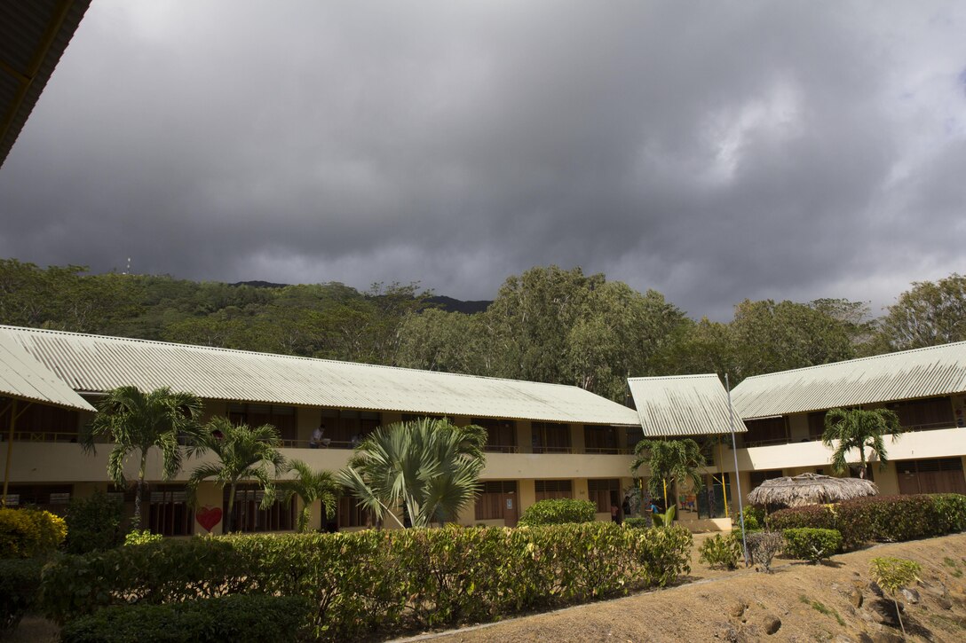 U.S. Marines assigned to the 26th Marine Expeditionary Unit (MEU) and U.S. Sailors from the USS Carter Hall (LSD 50) help clean up and repaint a school in Beau Vallon, Seychelles, Aug. 26, 2013. The 26th MEU is a Marine Air-Ground Task Force forward-deployed to the U.S. 5th Fleet area of responsibility aboard the Kearsarge Amphibious Ready Group serving as a sea-based, expeditionary crisis response force capable of conducting amphibious operations across the full range of military operations. (U.S. Marine Corps photo by Cpl. Michael S. Lockett/Released)
