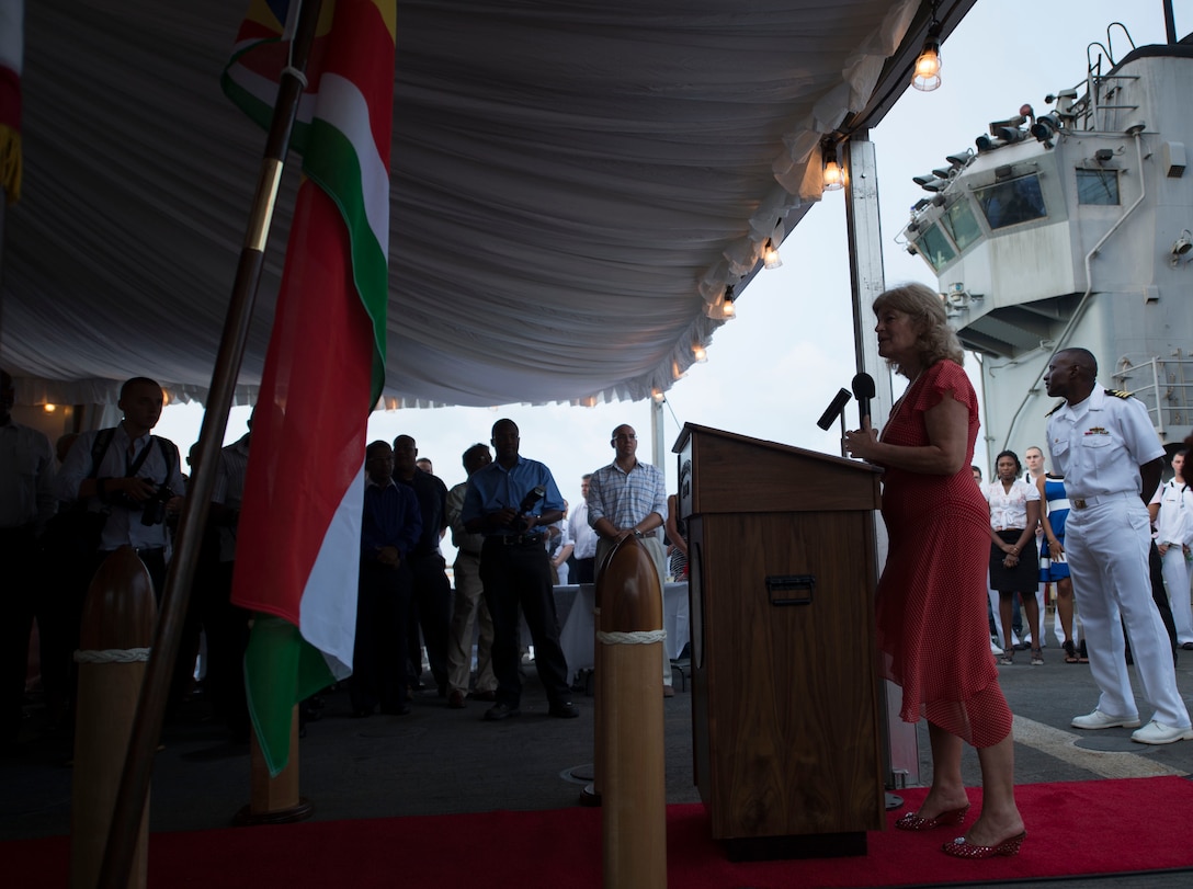 U.S. Ambassador Shari Villarosa addresses the U.S. Marines and U.S. Sailors of the 26th Marine Expeditionary Unit (MEU) and USS Carter Hall (LSD 50) during a reception aboard the USS Carter Hall while in the Seychelles, Aug. 27, 2013. The 26th MEU is a Marine Air-Ground Task Force forward-deployed to the U.S. 5th Fleet area of responsibility aboard the Kearsarge Amphibious Ready Group serving as a sea-based, expeditionary crisis response force capable of conducting amphibious operations across the full range of military operations. (U.S. Marine Corps photo by Cpl. Michael S. Lockett/Released)