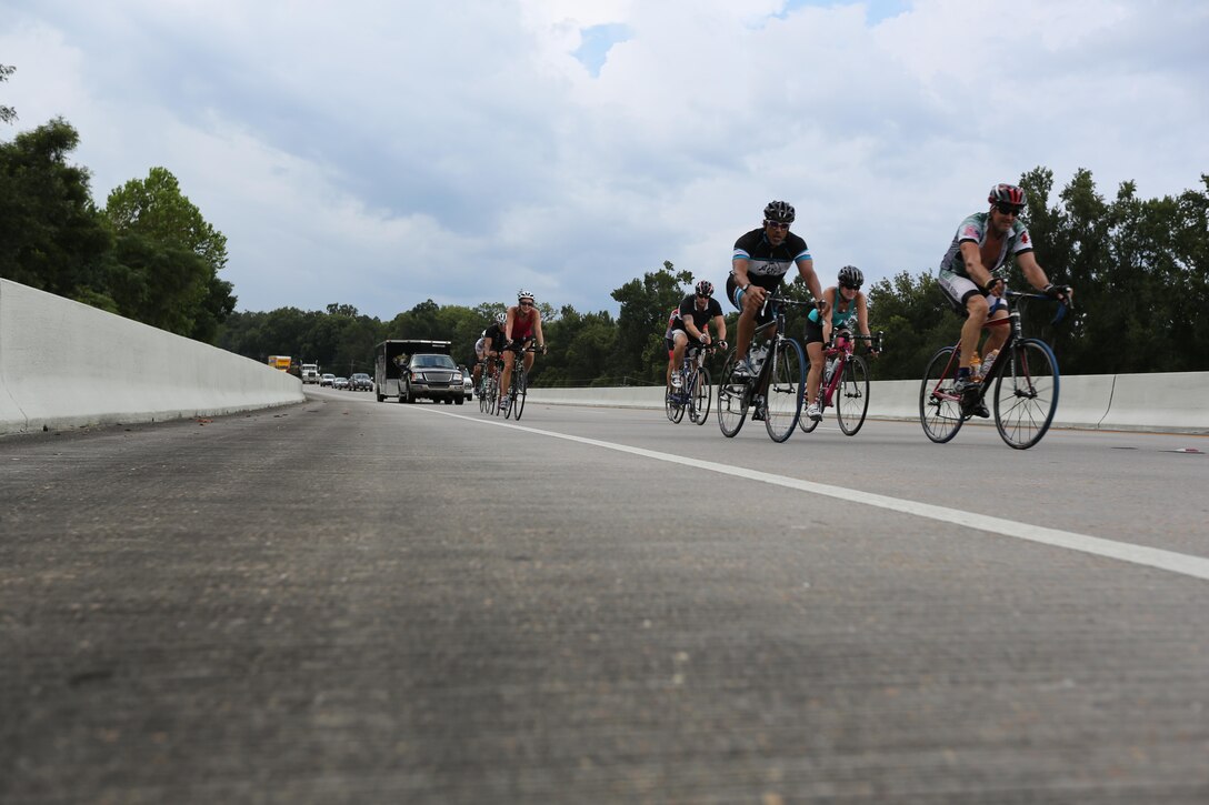 Servicemembers, members of the Gwinnett Sheriffs department and Georgia State Trooper ride down a bridge during the Operation One Voice Honor Ride, Sept. 4, 2013. Marines with U.S. Marine Corps Forces Special Operations Command were invited to ride in the Honor Ride to support wounded and deceased veteran members of the U.S. Special Operations community.The Honor Ride this year was a 450-mile bike ride over a four day period.  (U.S. Marine Corps courtesy photo/Released)