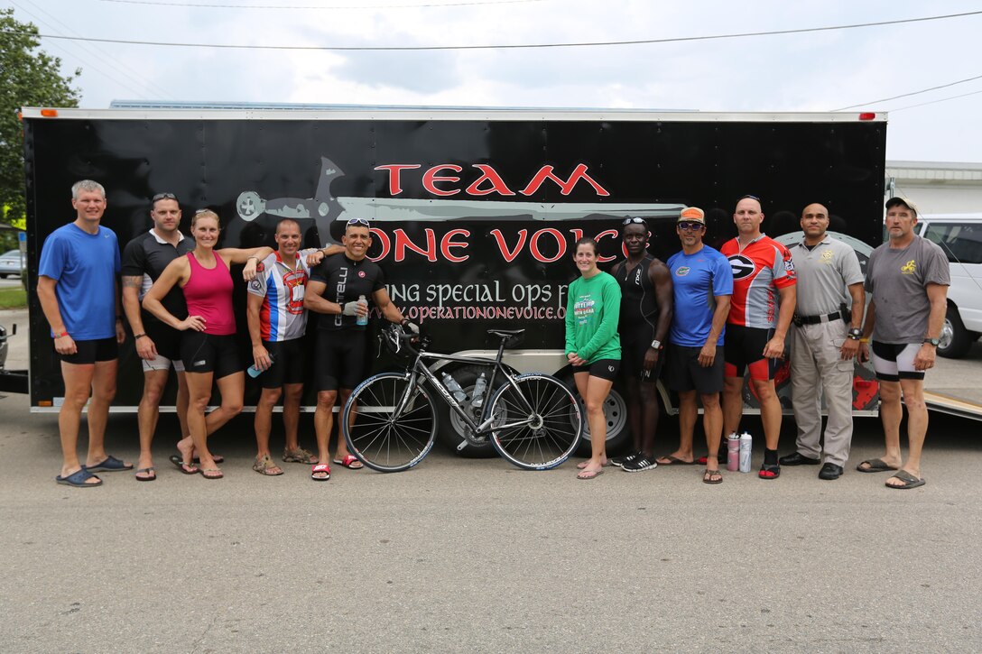 Servicemembers, members of the Gwinnett Sheriffs department and Georgia State Trooper pose for a picture after completing the first day of the Operation One Voice Honor Ride, Sept. 4, 2013. Marines with U.S. Marine Corps Forces Special Operations Command were invited to ride in the Honor Ride to support wounded and deceased veteran members of the U.S. Special Operations community.The Honor Ride this year was a 450-mile bike ride over a four day period. (U.S. Marine Corps photo by Sgt. Anthony Carter/Released)