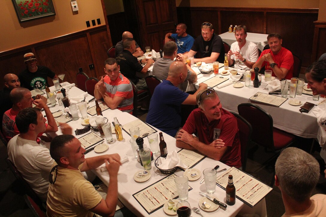 Servicemembers, members of the Gwinnett Sheriffs department and Georgia State Trooper participating in the 2013 Operation One Voice Honor Ride take time to enjoy dinner after the second day of the bike-ride, Sept. 5, 2013 on their way to Buford, GA from Ft. Walton, FL. Marines with U.S. Marine Corps Forces Special Operations Command were invited to ride in the Honor Ride to support wounded and deceased veteran members of the U.S. Special Operations community.The Honor Ride this year was a 450-mile bike ride over a four day period. (U.S. Marine Corps courtesy photo/Released)