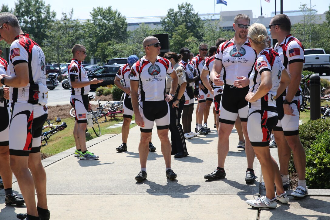 Servicemembers, members of the Gwinnett Sheriffs department, Georgia State Trooper and volunteers speak to each other after completing the third day of the Operation One Voice Honor Ride, Sept. 6, 2013. Marines with U.S. Marine Corps Forces Special Operations Command were invited to ride in the Honor Ride to support wounded and deceased veteran members of the U.S. Special Operations community.The Honor Ride this year was a 450-mile bike ride over a four day period. (U.S. Marine Corps photo by Sgt. Anthony Carter/Released)
