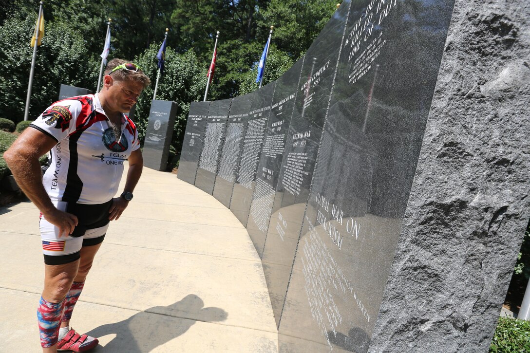 Major Gen. Mark A. Clark, commander, U.S. Marine Corps Forces, Special Operations Command, observes the Fallen Heroes Memorial at the Gwinnett County Administration Building after the third day of the Operation One Voice Honor Ride, Sept. 6, 2013. Marines with U.S. Marine Corps Forces Special Operations Command were invited to ride in the Honor Ride to support wounded and deceased veteran members of the U.S. Special Operations community.The Honor Ride this year was a 450-mile bike ride over a four day period. (U.S. Marine Corps photo by Sgt. Anthony Carter/Released)
