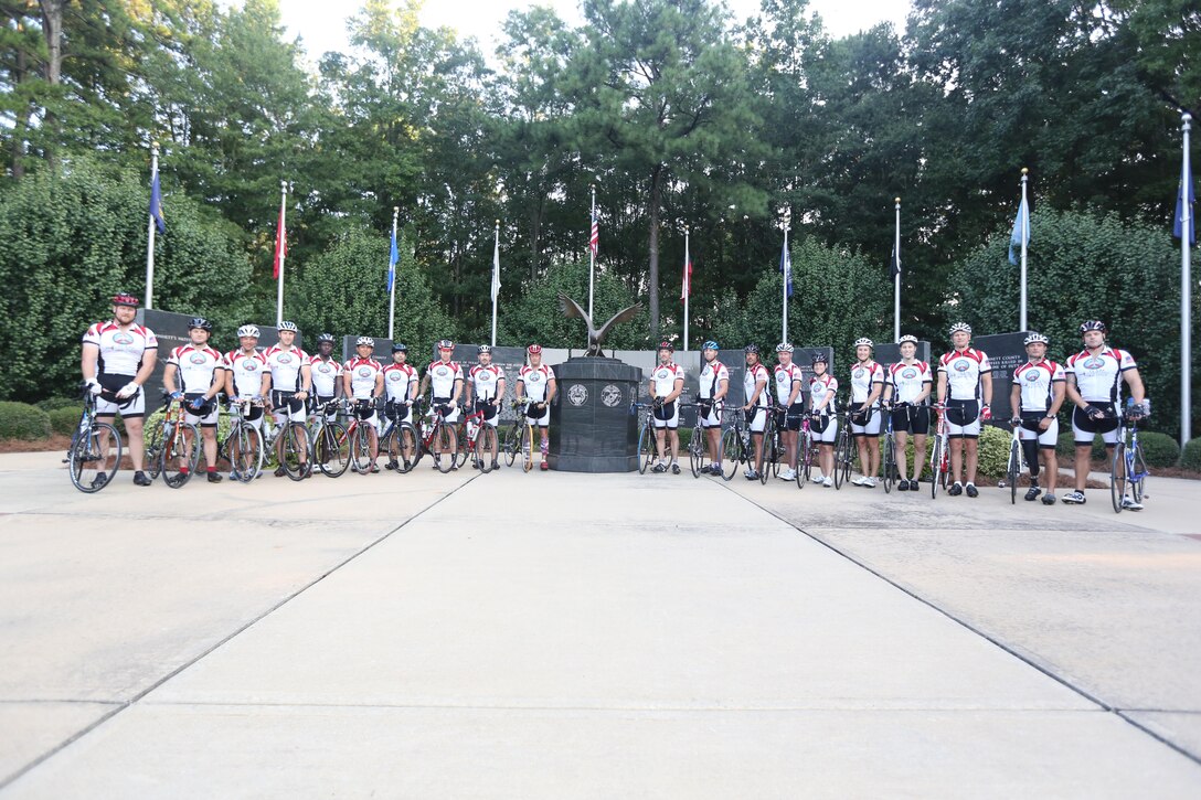 Servicemembers, members of the Gwinnett Sheriffs department, Georgia State Trooper and volunteers pose for a picture before beginning the final day of the Operation One Voice Honor Ride, Sept. 7, 2013. Marines with U.S. Marine Corps Forces Special Operations Command were invited to ride in the Honor Ride to support wounded and deceased veteran members of the U.S. Special Operations community.The Honor Ride this year was a 450-mile bike ride over a four day period. (U.S. Marine Corps photo by Sgt. Anthony Carter/Released)
